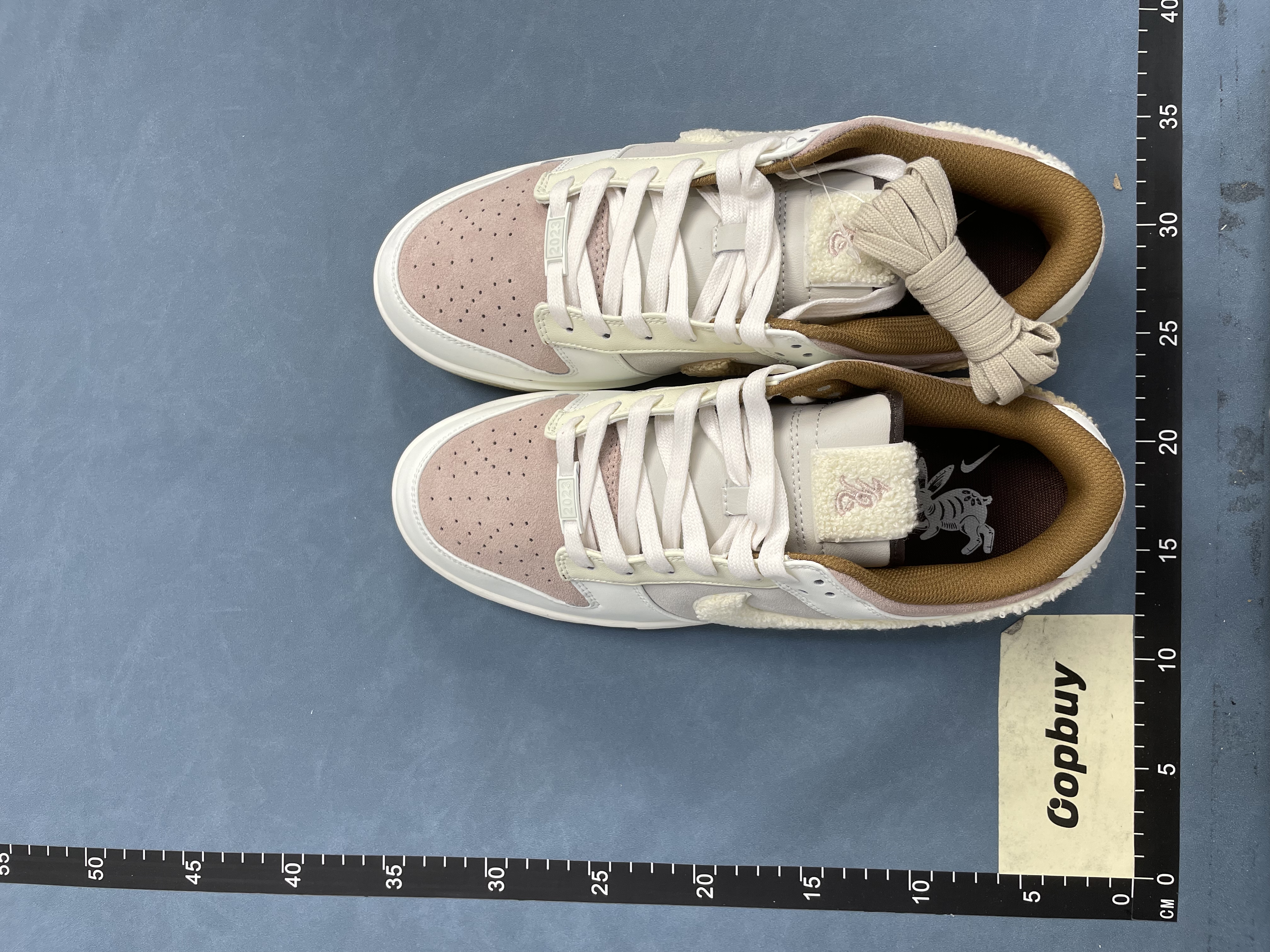 Nike Dunk Low White Beige Suede Rabbit Logo Sneakers