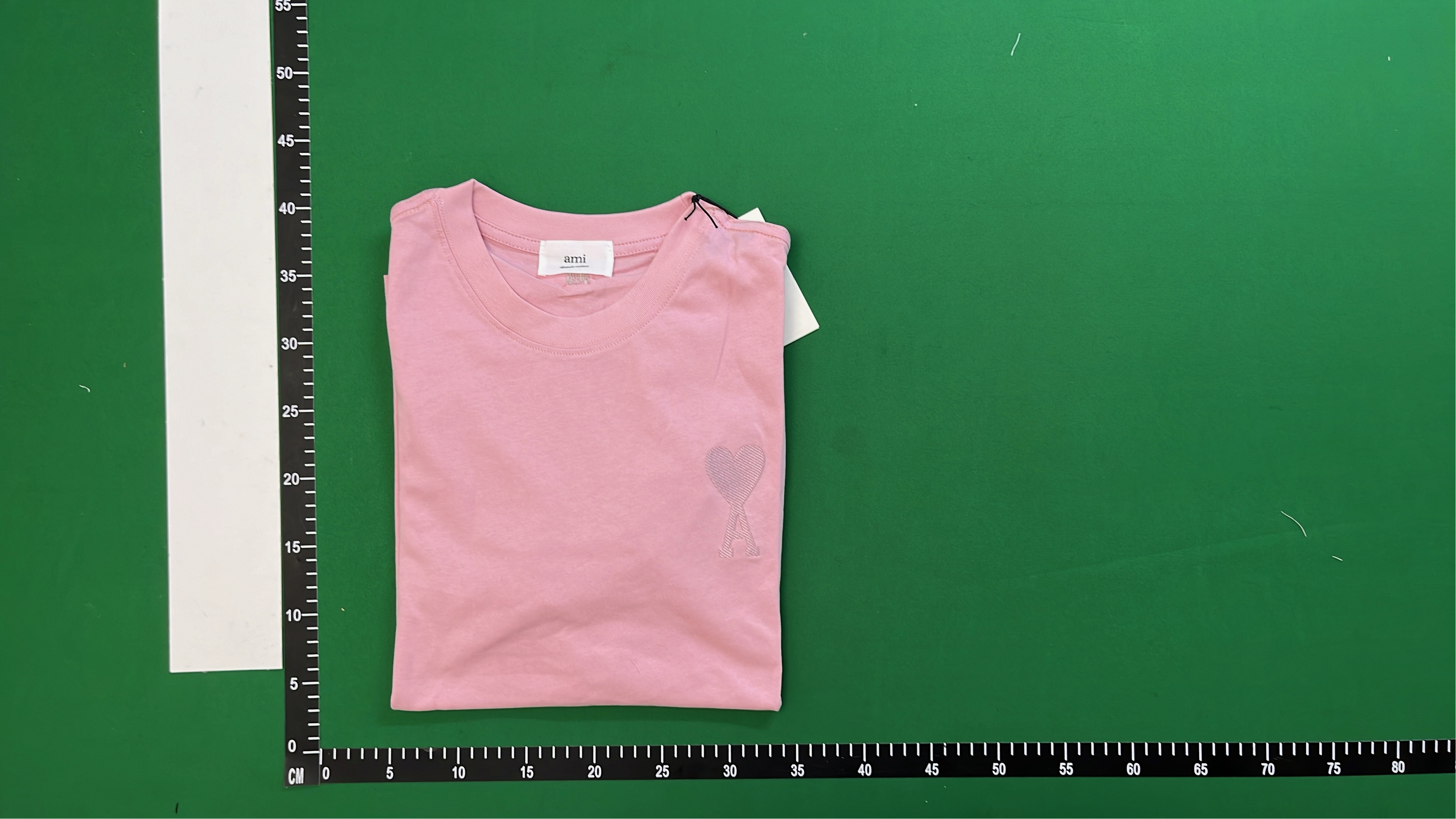White T-Shirt with Red Heart Logo by alexandre mattiussi