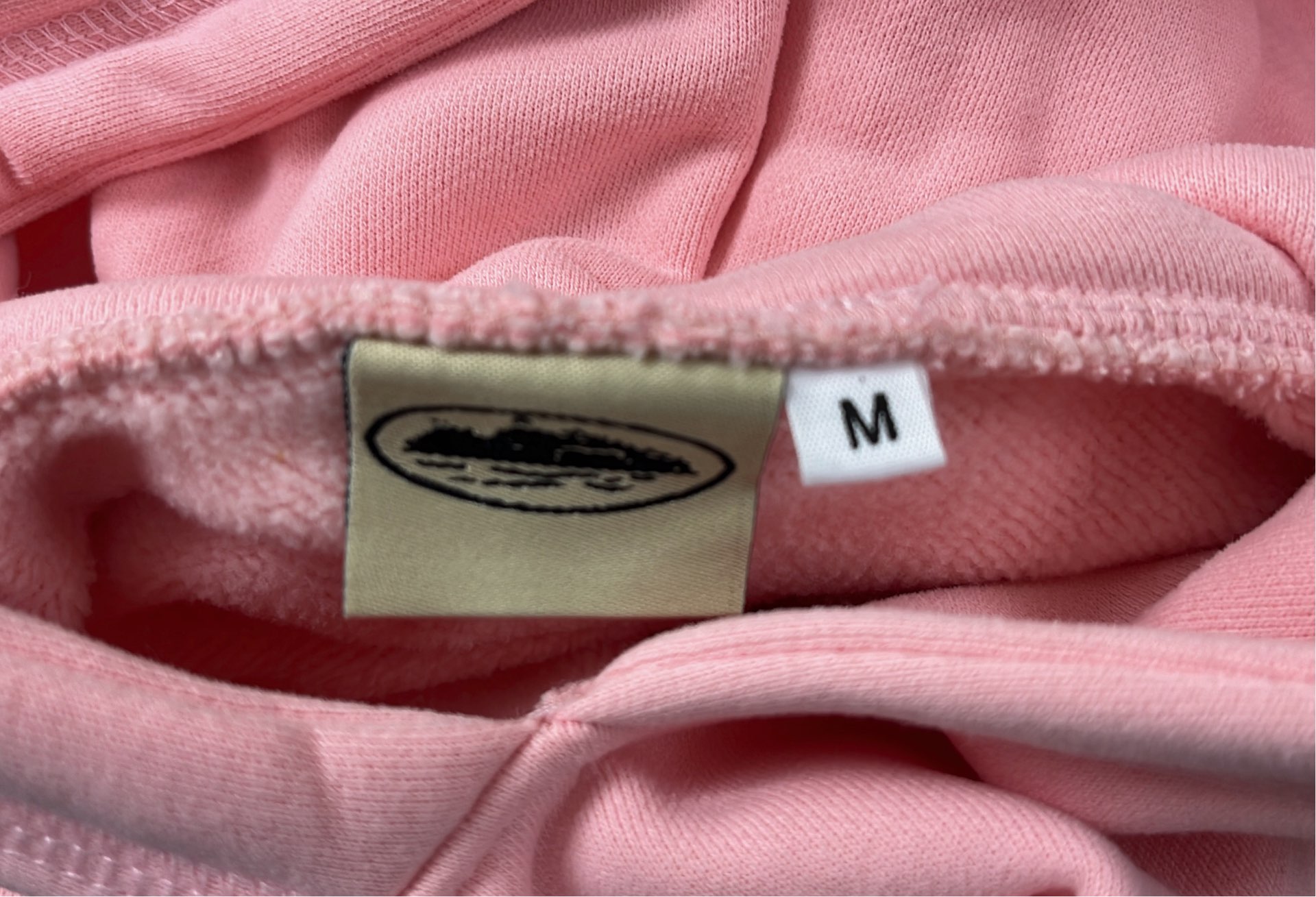 Pink Hoodie with Oval Logo Design
