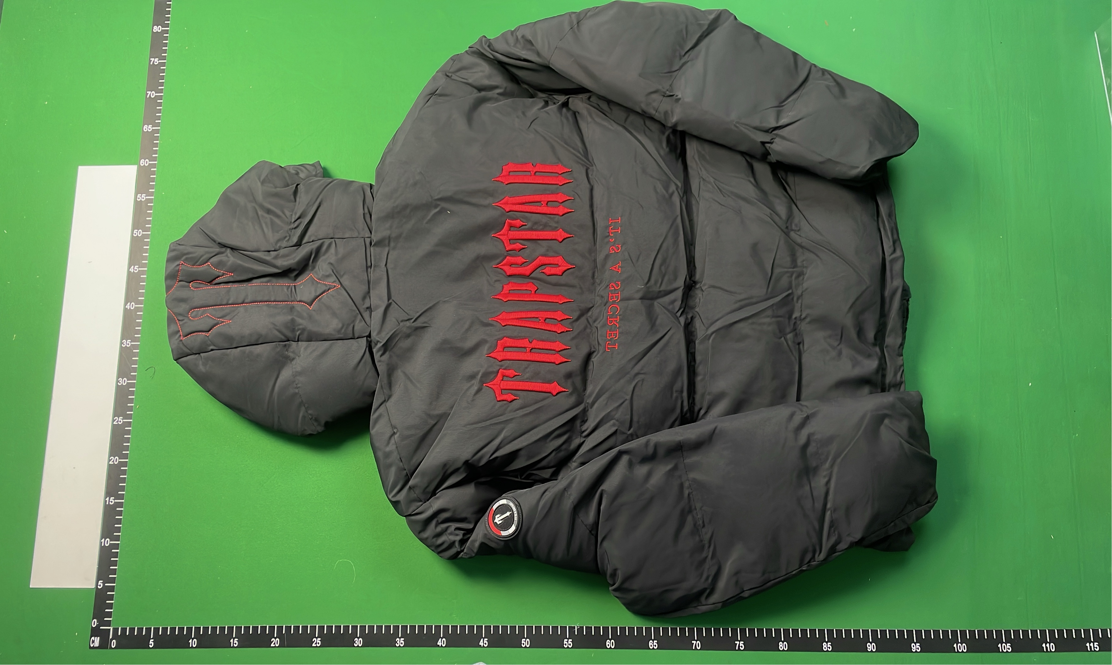 Black Hooded Puffer Jacket with Red Accent Design
