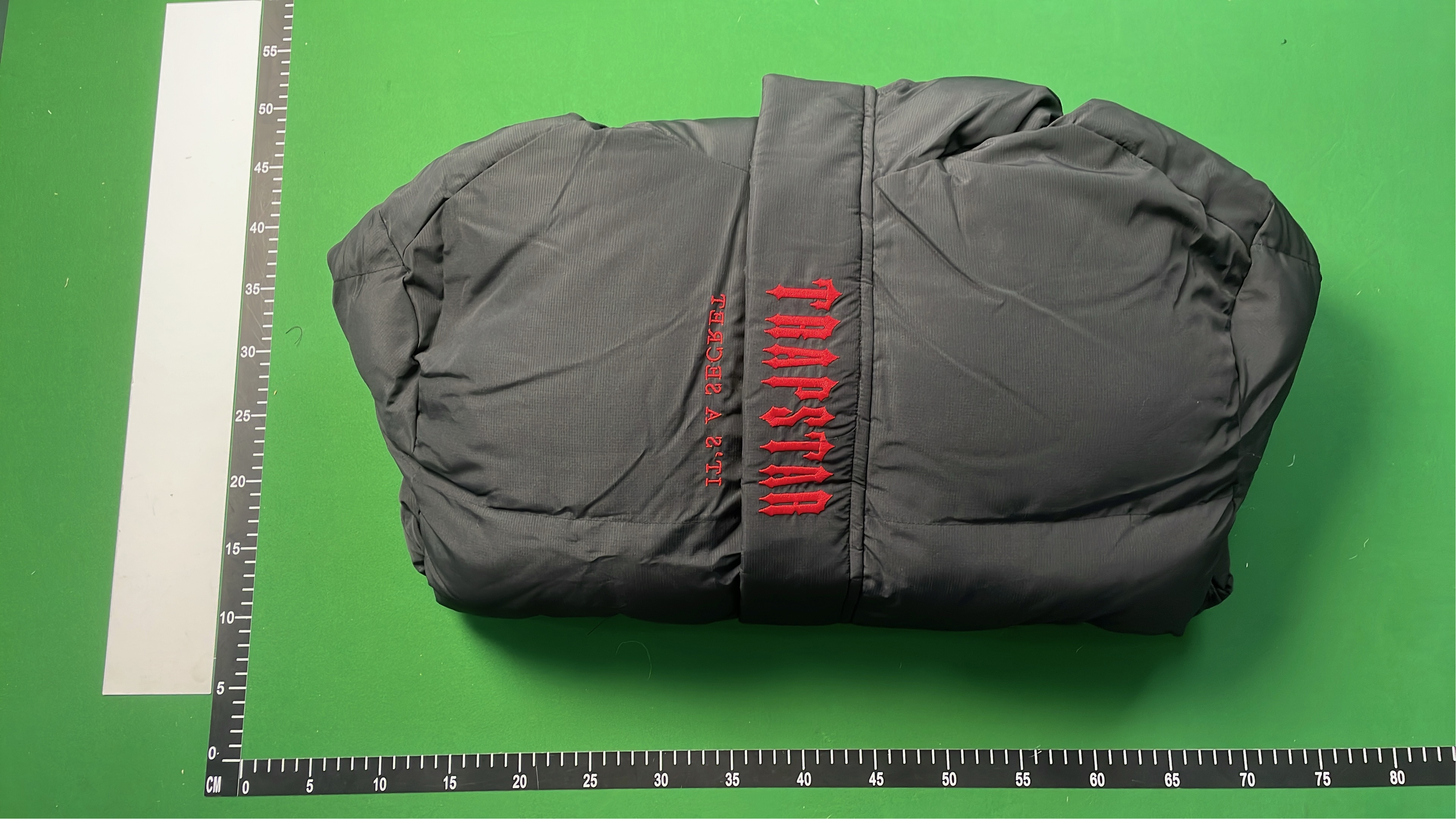 Black Hooded Puffer Jacket with Red Accent Design