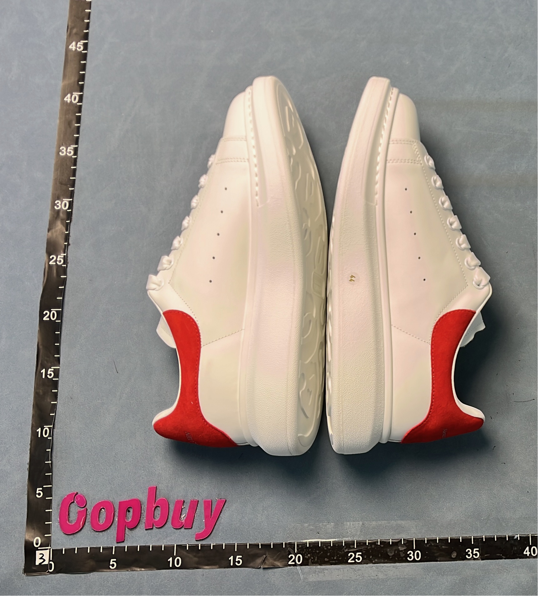 White Sneakers with Blue Heel Tab