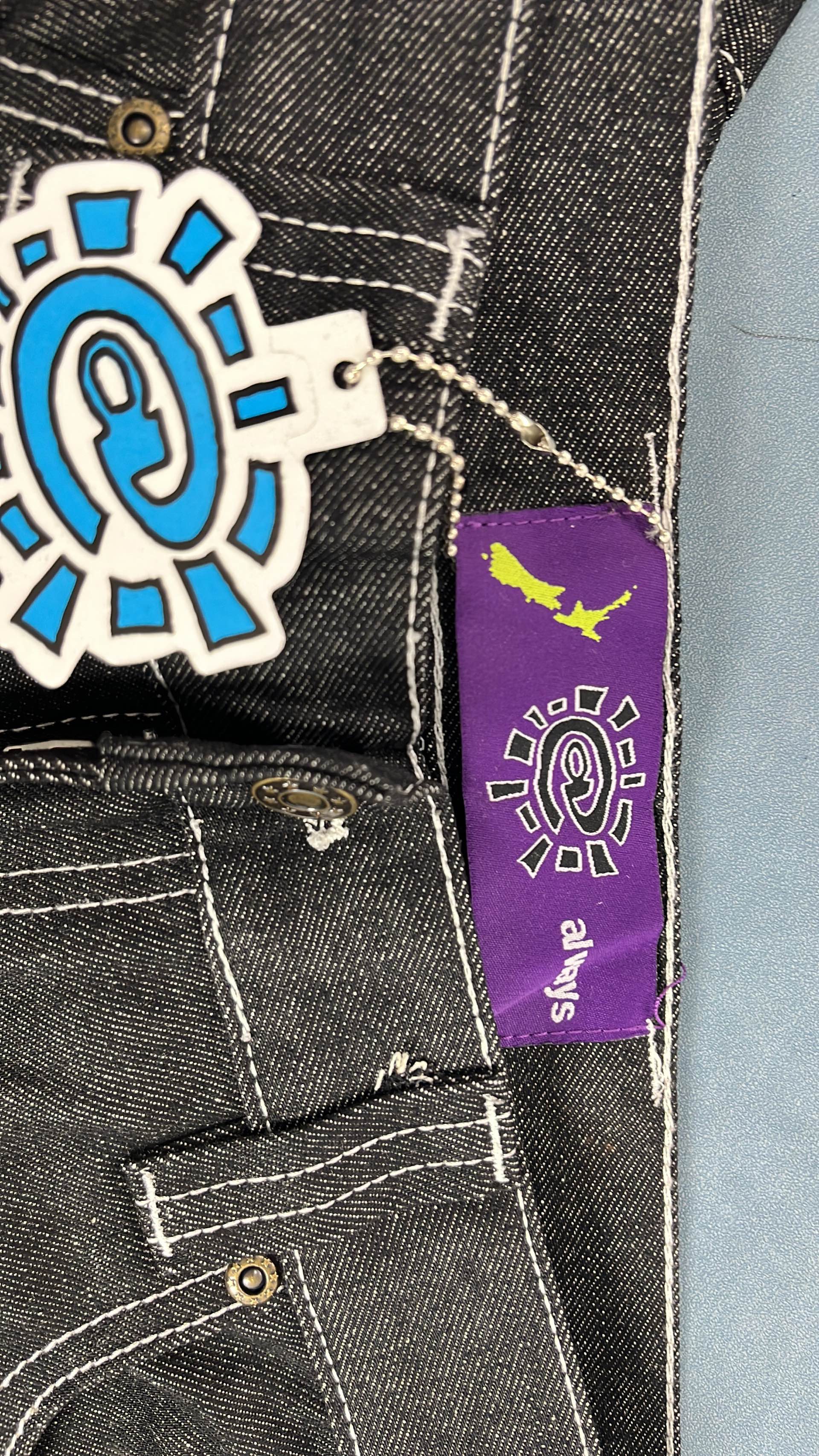 Light Blue and Black Denim Pants with Eye Patch Design
