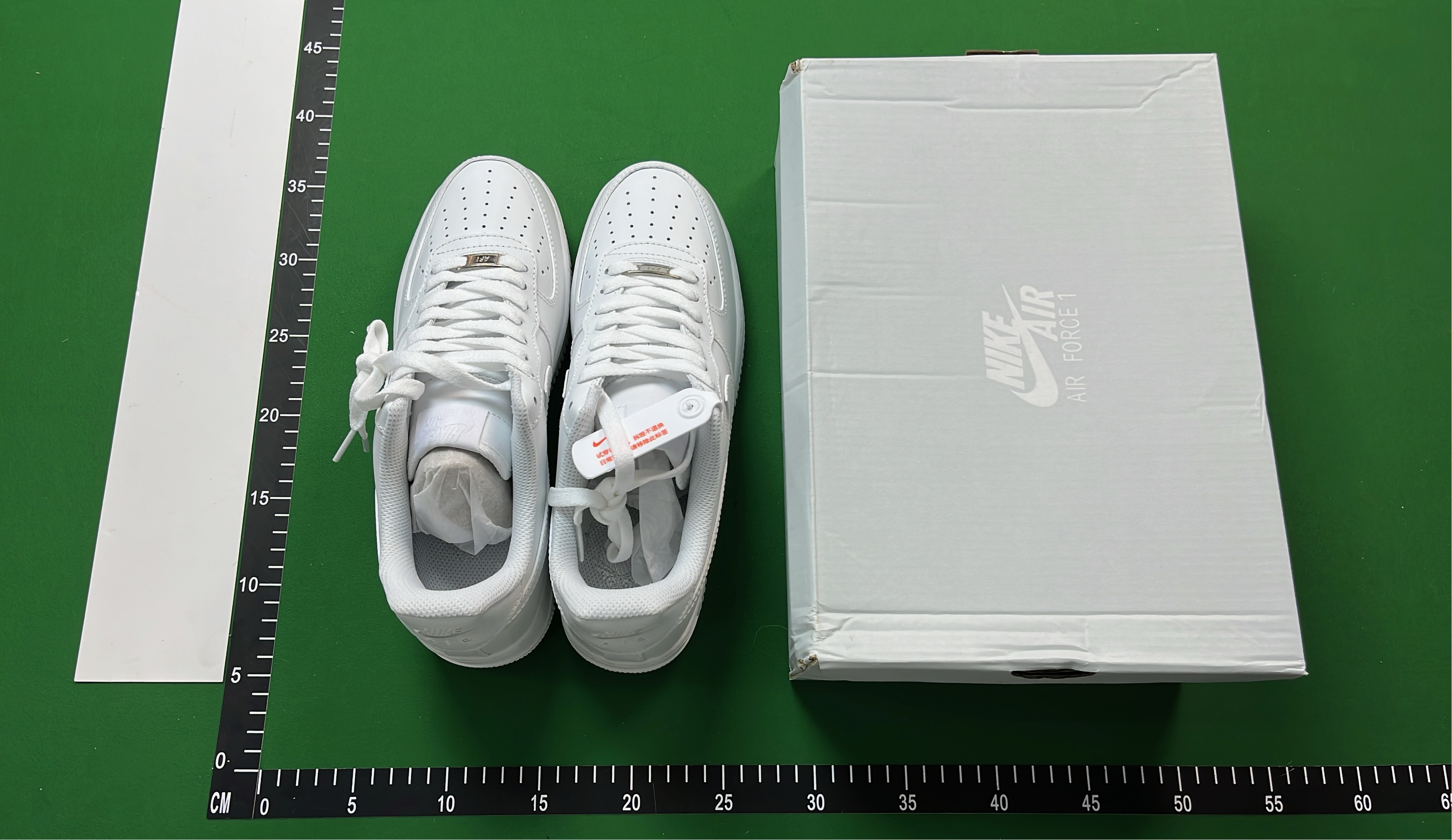 White Low-Top Sneakers with Pixelated Swoosh Design