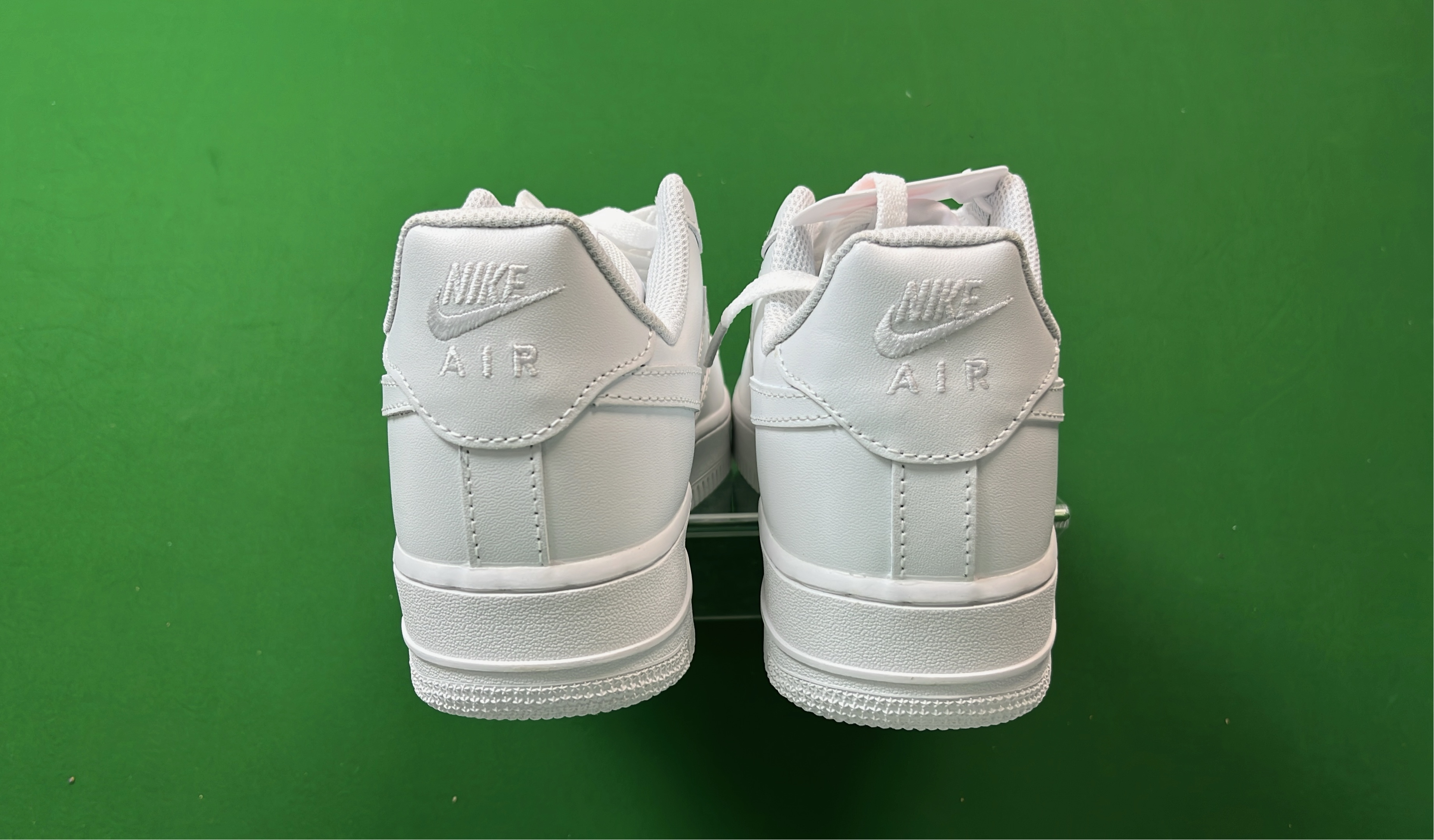 White Low-Top Sneakers with Pixelated Swoosh Design