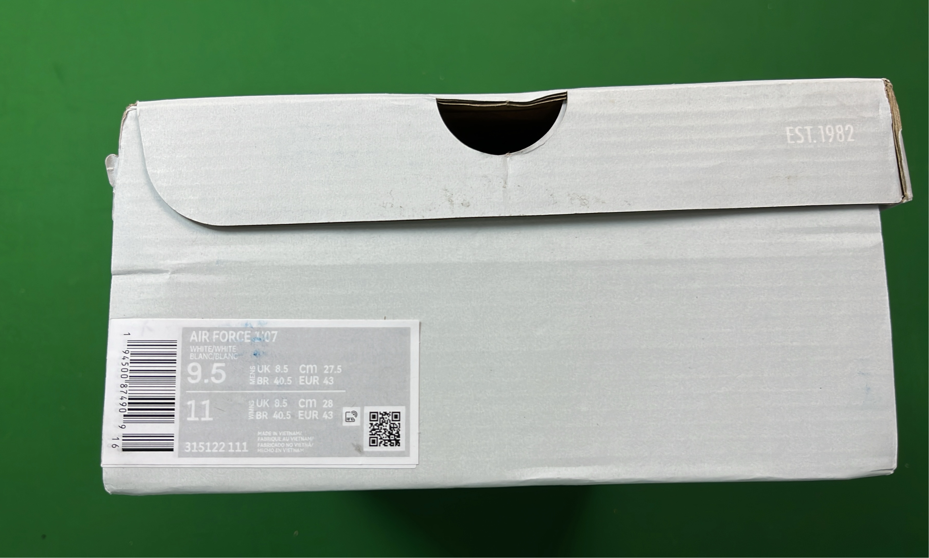 White Low-Top Sneakers with Pixelated Swoosh Design