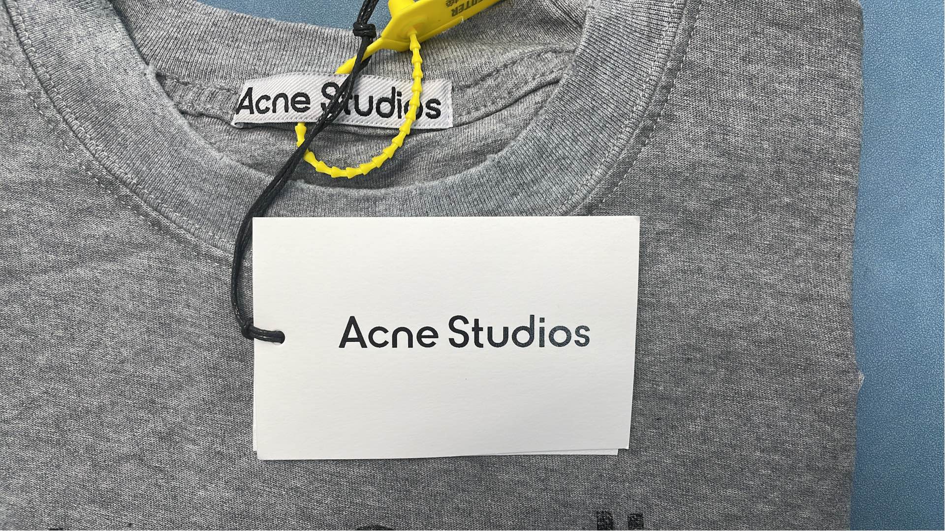 Gray T-Shirt with Distressed Sleeve Detail