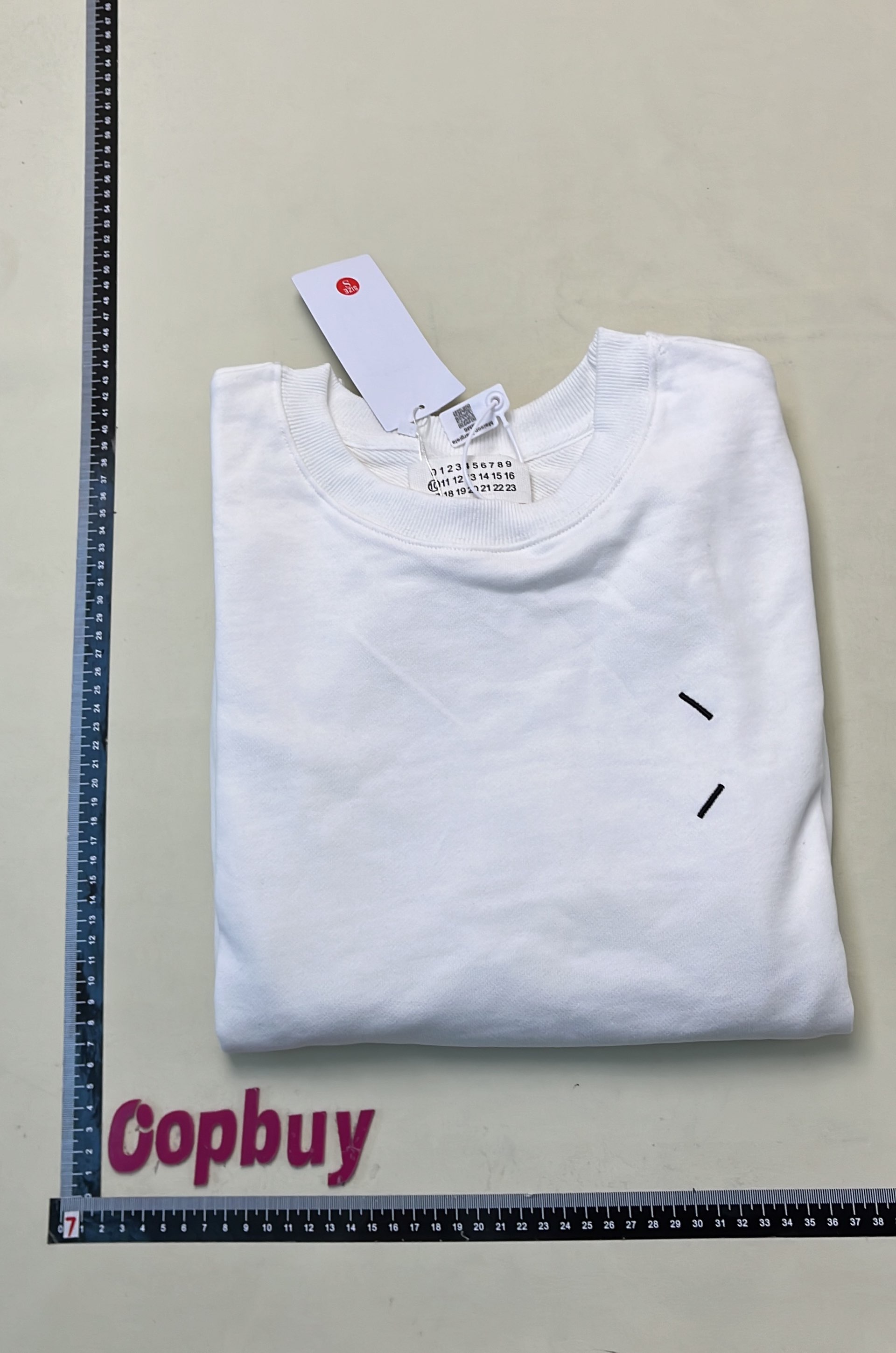 Black Minimalist Sweatshirt with Subtle Cross Logo