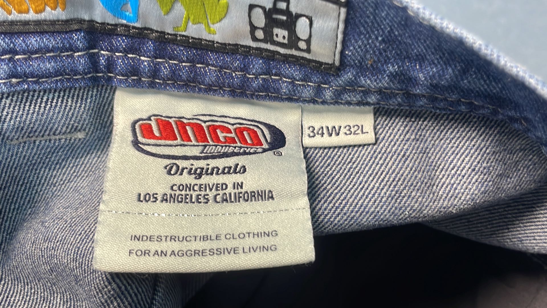Stussy Wide Leg Denim Jeans with Graphic Patch