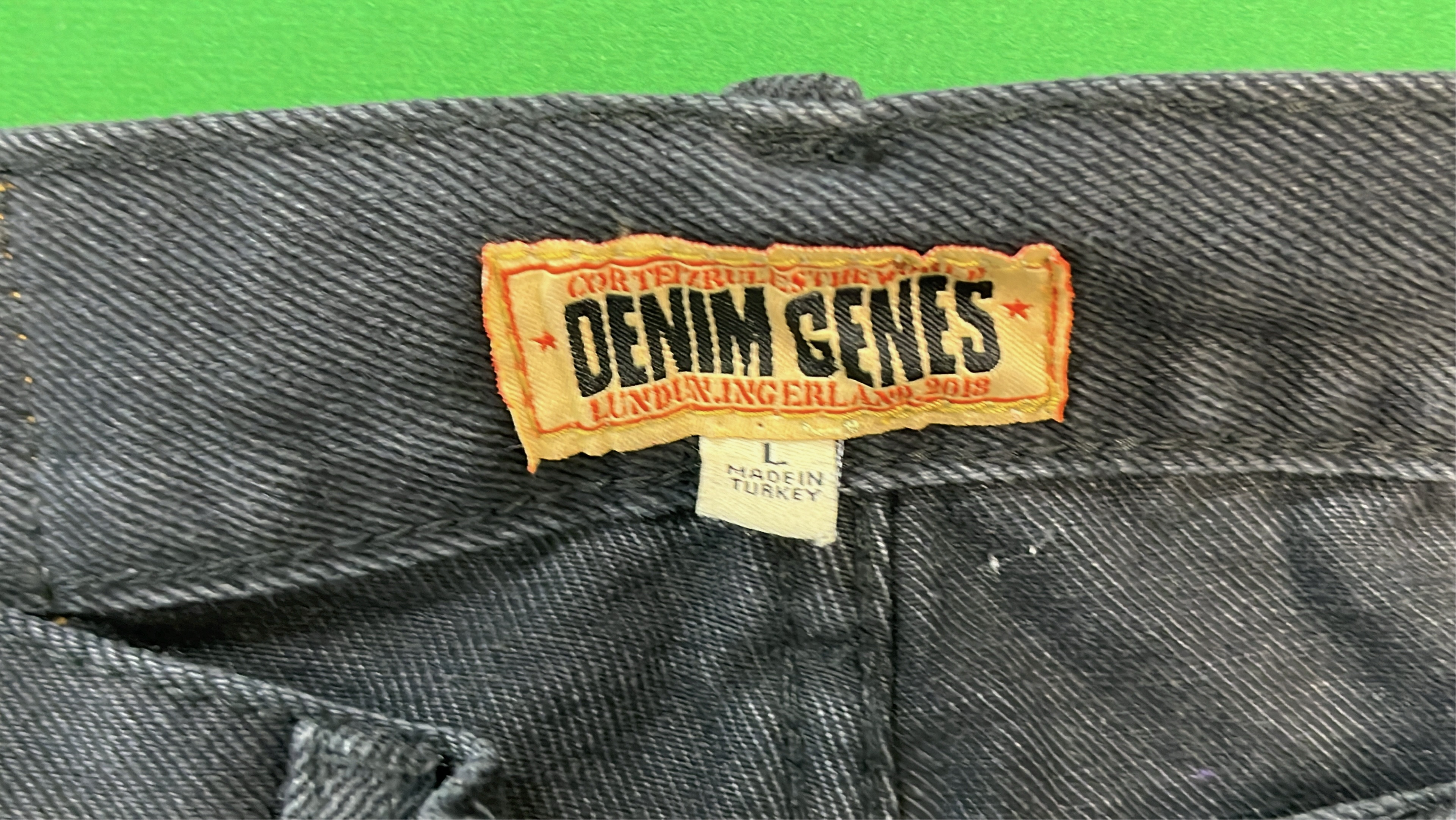 Black Denim Shorts with White Oval Logo Design