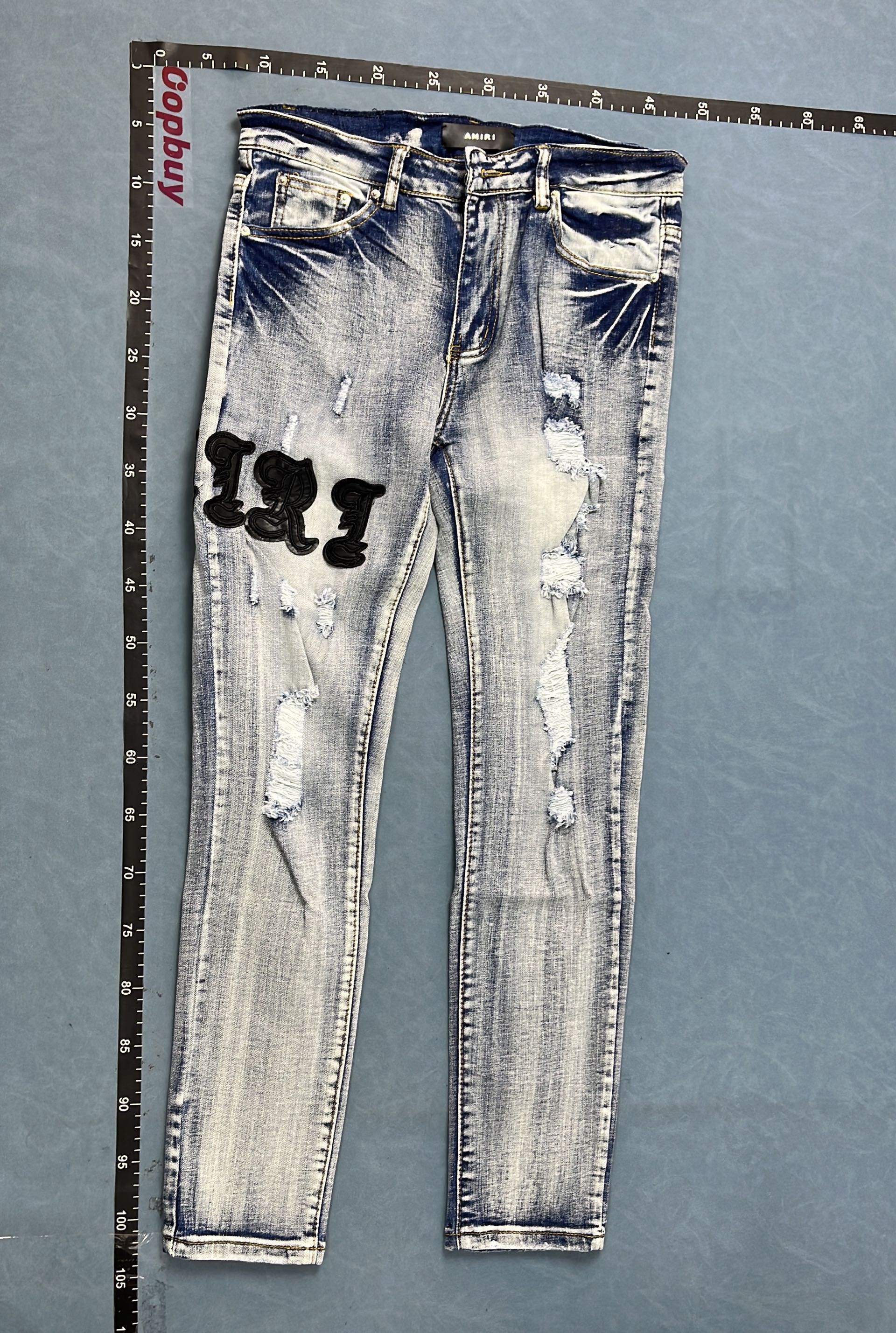 Distressed Denim Jeans with Red Embroidery