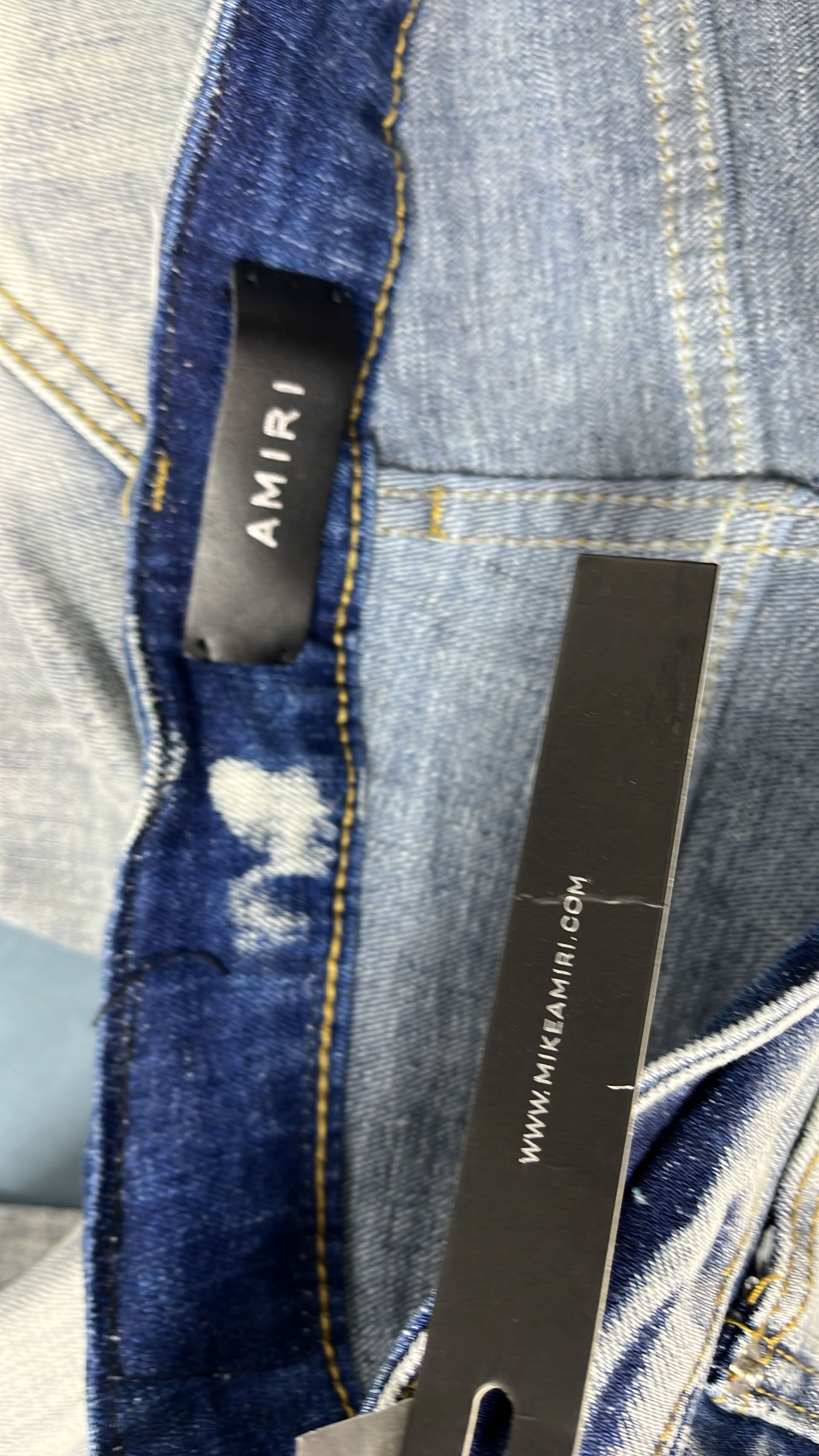 Distressed Denim Jeans with Red Embroidery