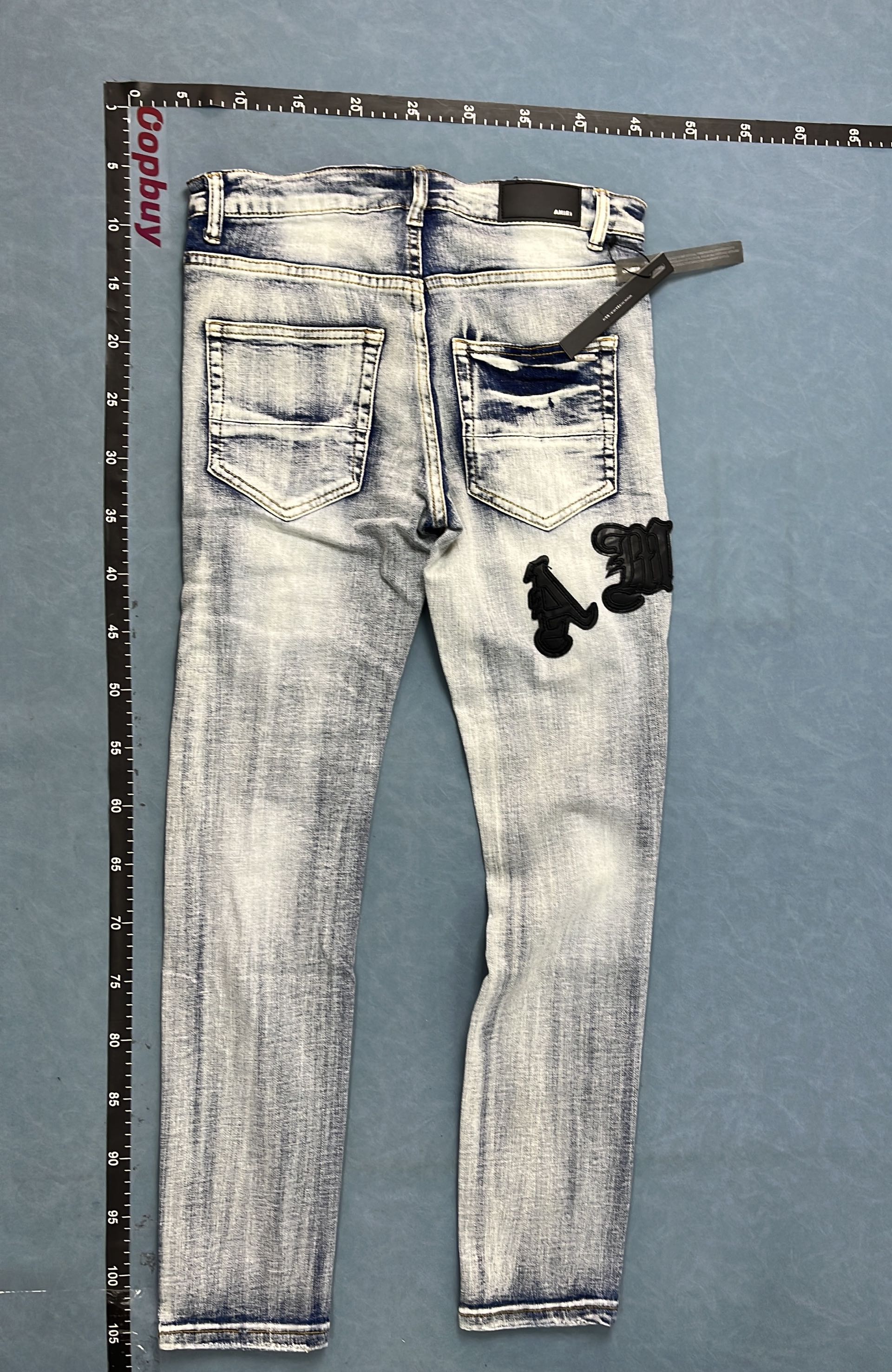 Distressed Denim Jeans with Red Embroidery