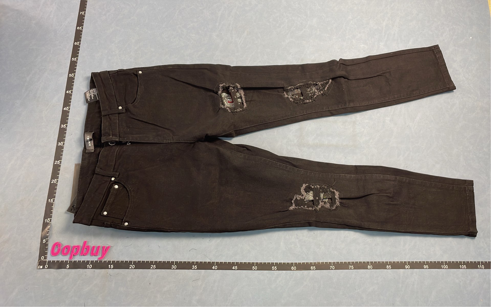 Ripped Denim Jeans with Colorful Patches and Zipper Details