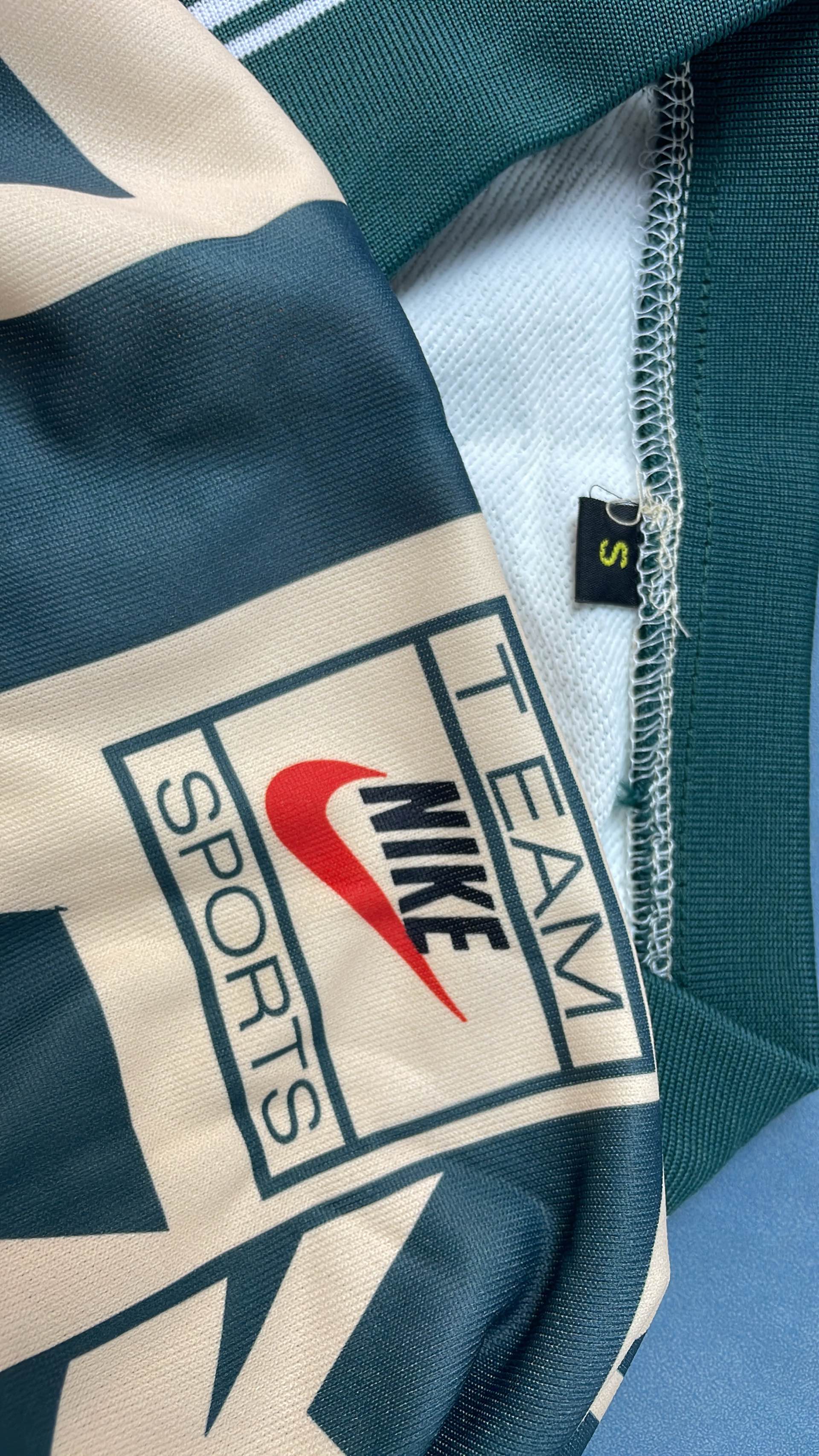Nike Team Sports Oversized Polo Shirt with Bold Logo Design