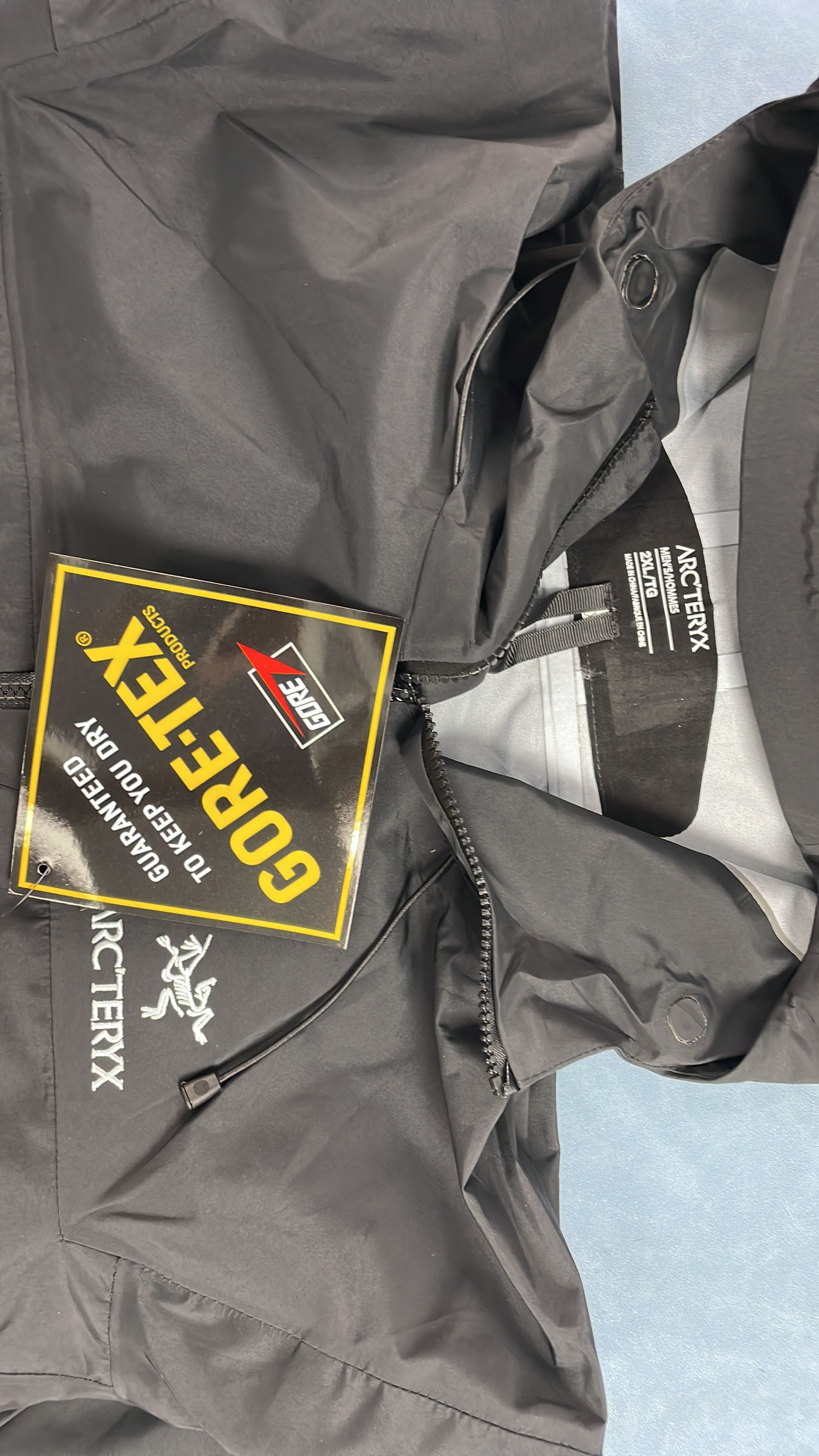 Men's Waterproof Hiking Jacket with Hood and Zippered Pockets