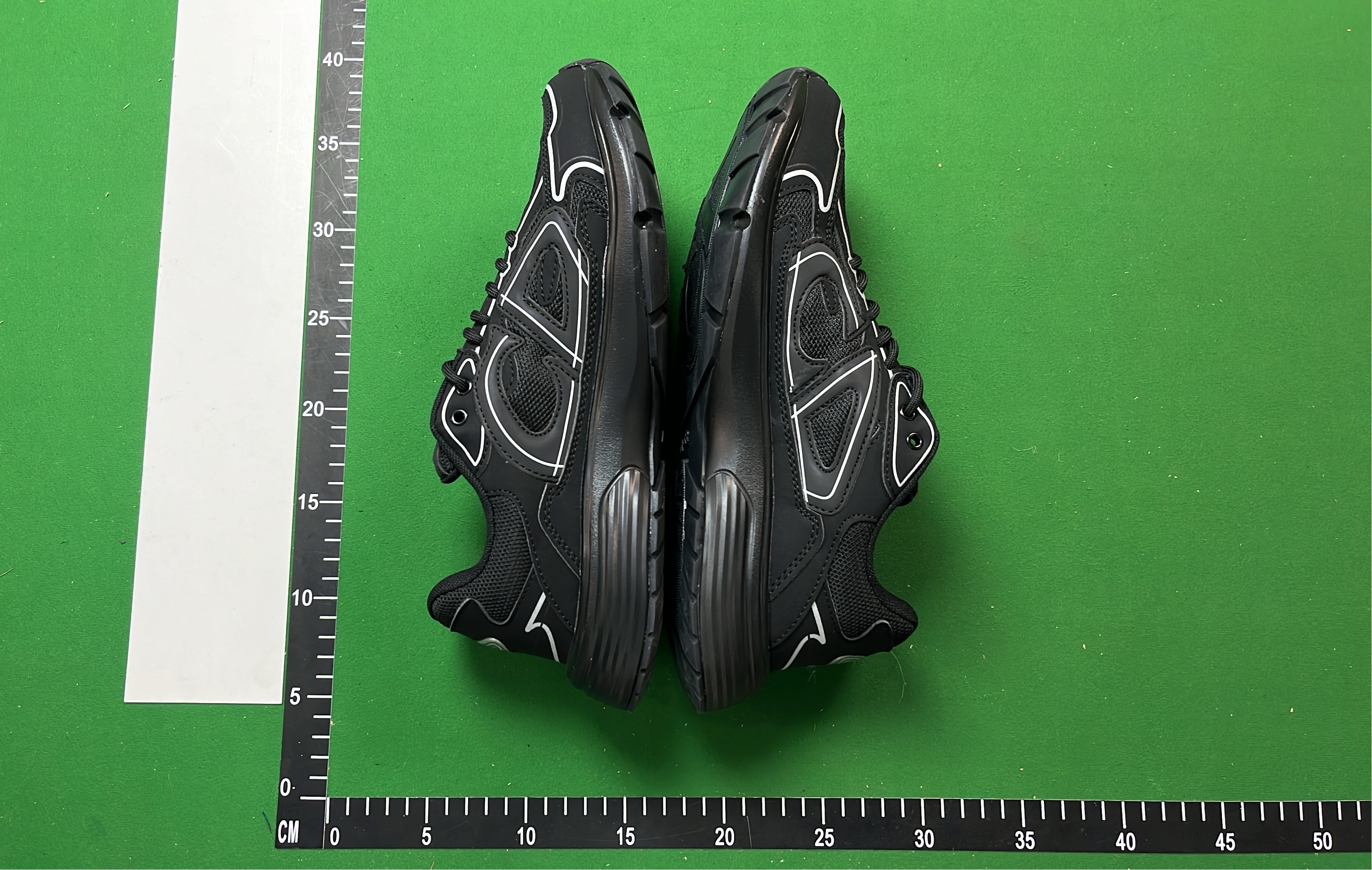 Dior Black Sneakers with White Stitching and Logo Detail