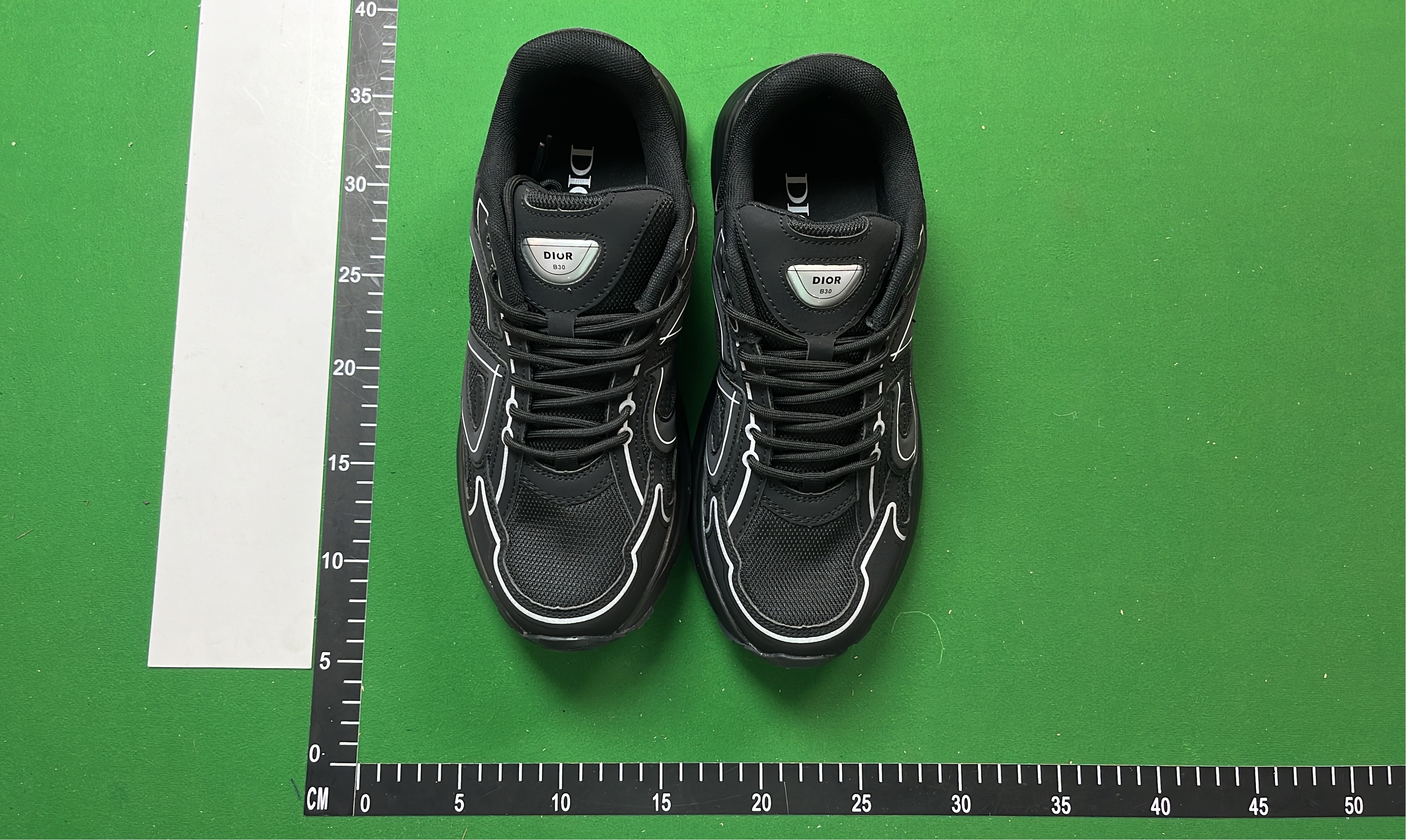 Dior Black Sneakers with White Stitching and Logo Detail