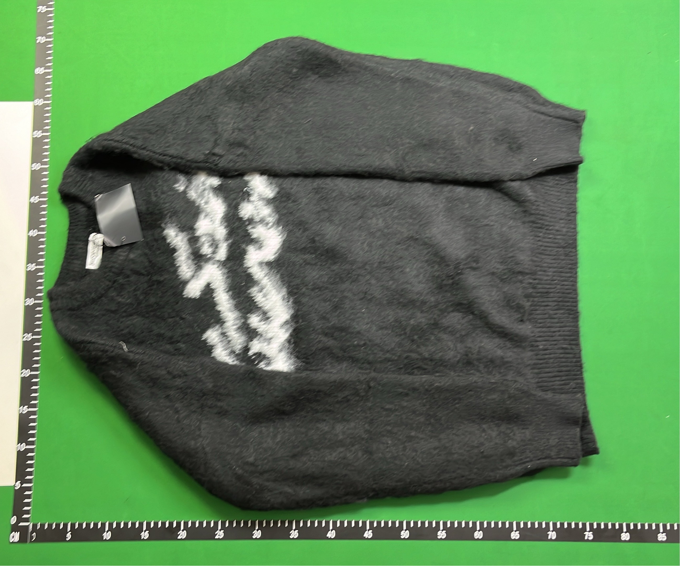 Black Knit Sweater with White Pattern Design