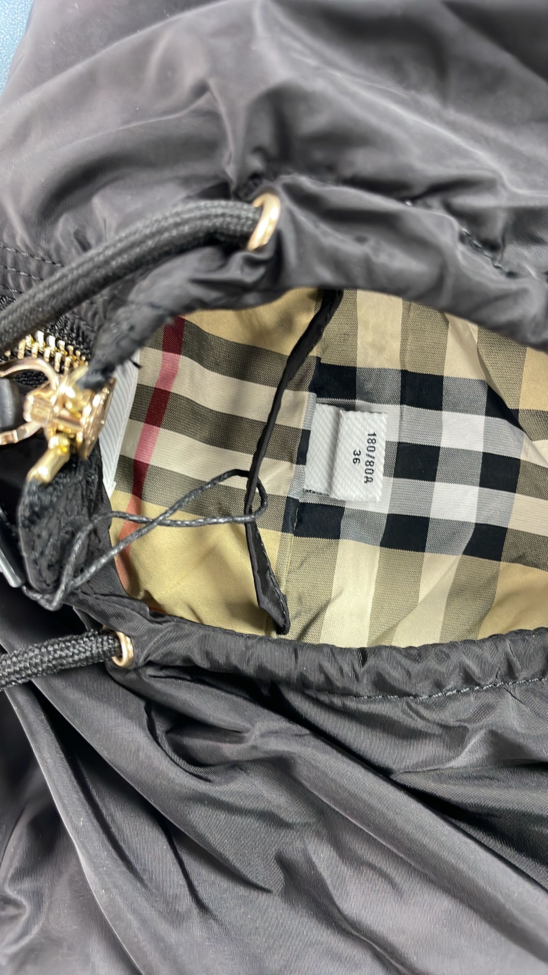 Black Hooded Rain Jacket with Check Lining