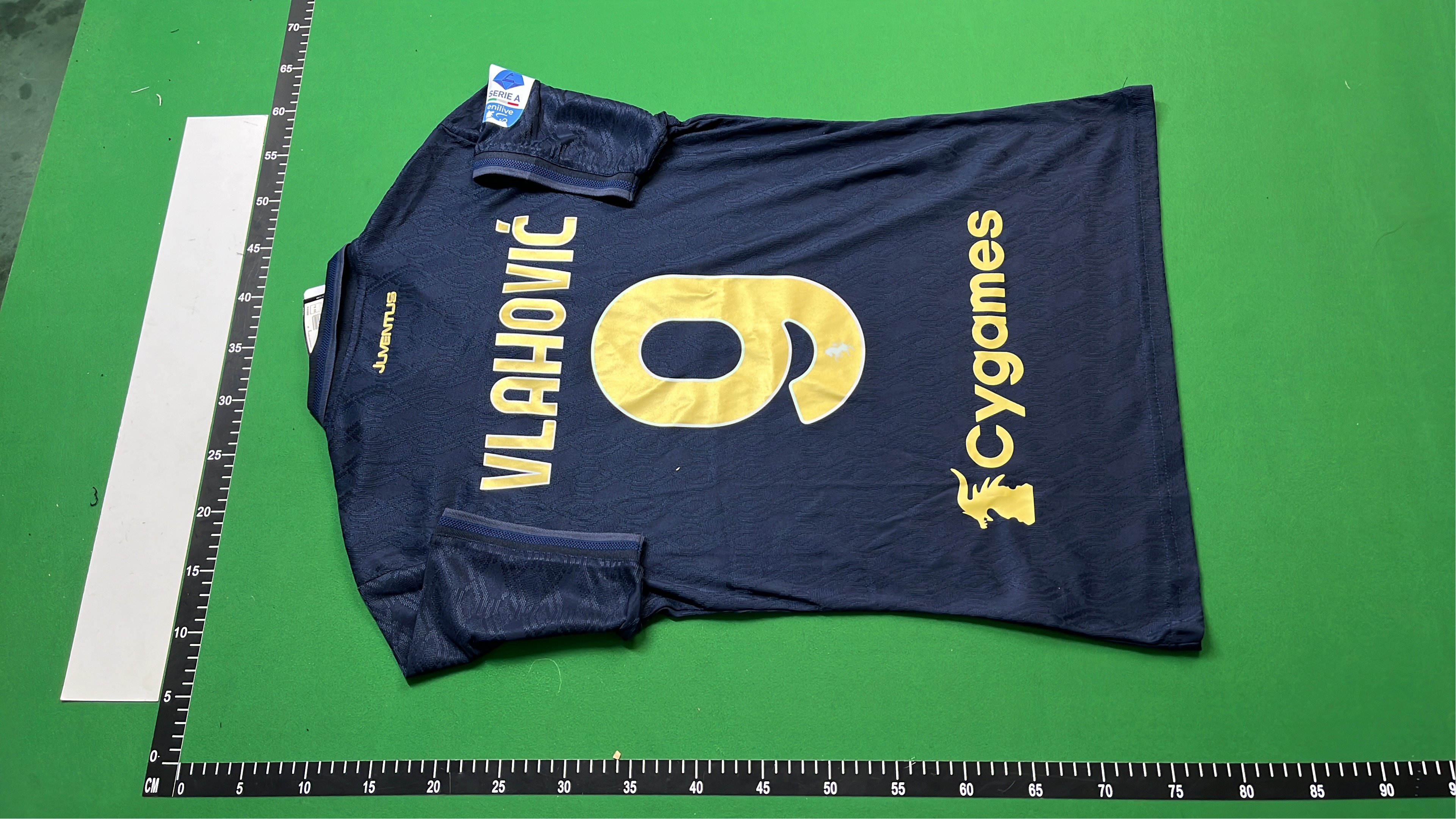 Save the Children Navy Blue Polo Shirt with Gold Logo