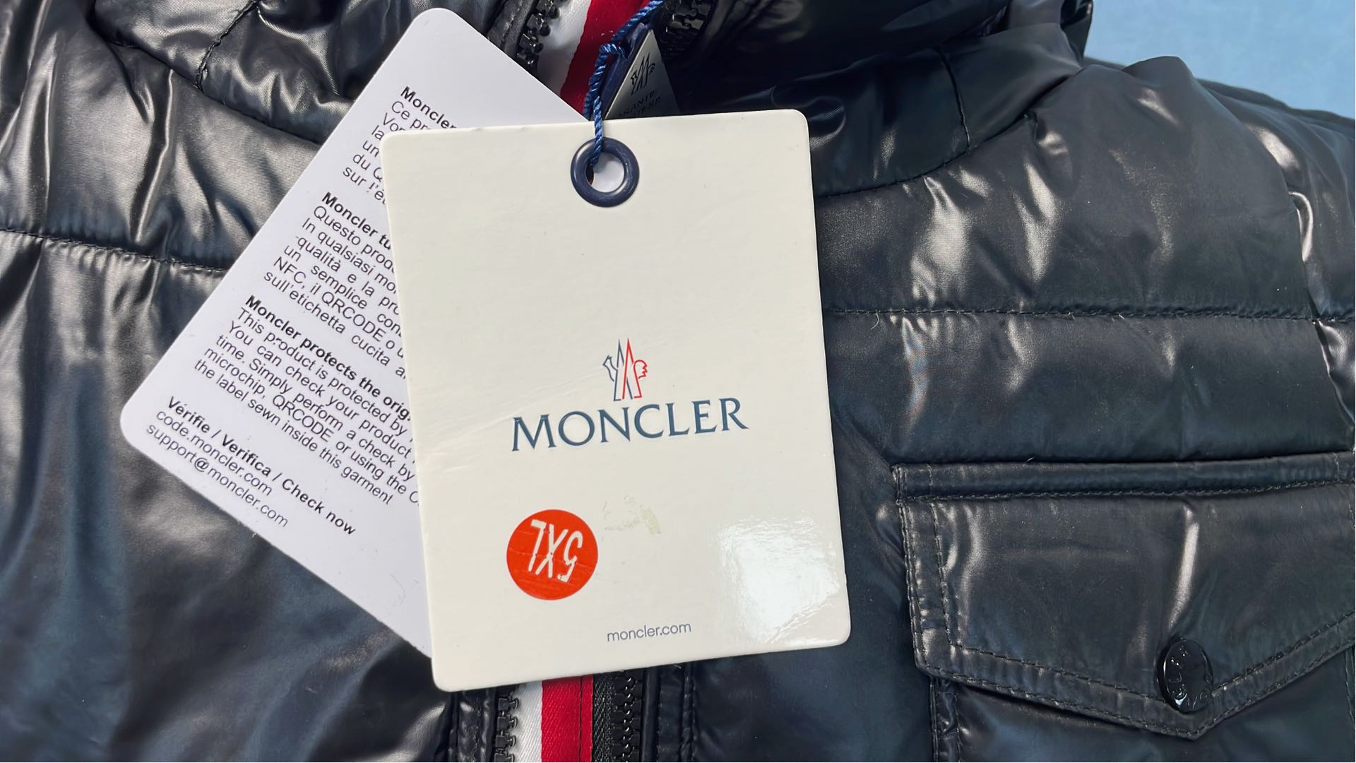 Moncler Black Puffer Jacket with Hood and Red Zipper