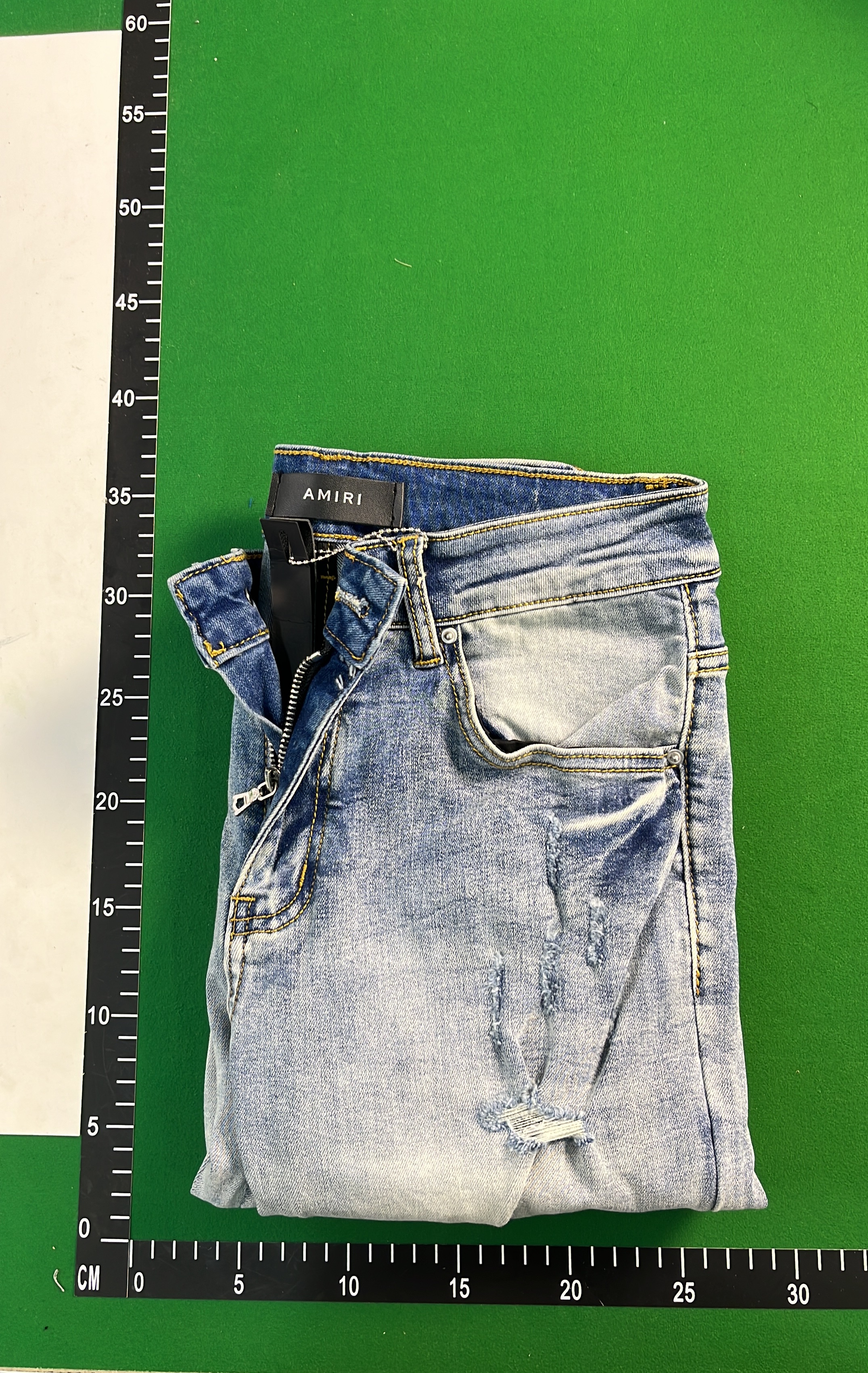 Ripped Denim Jeans with Bold Lettering for Men