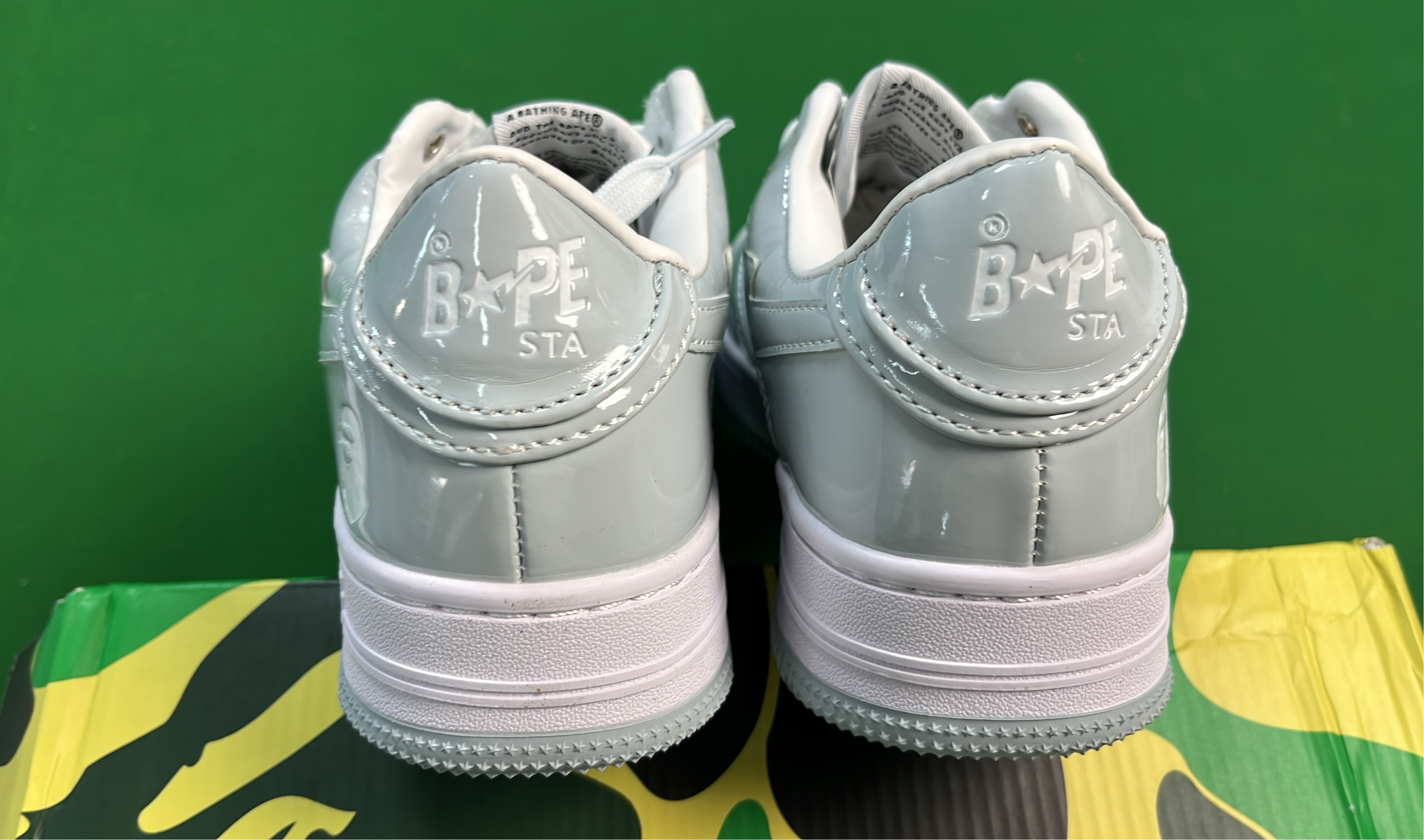 K-Swiss White Low-Top Sneakers with Black Logo Design