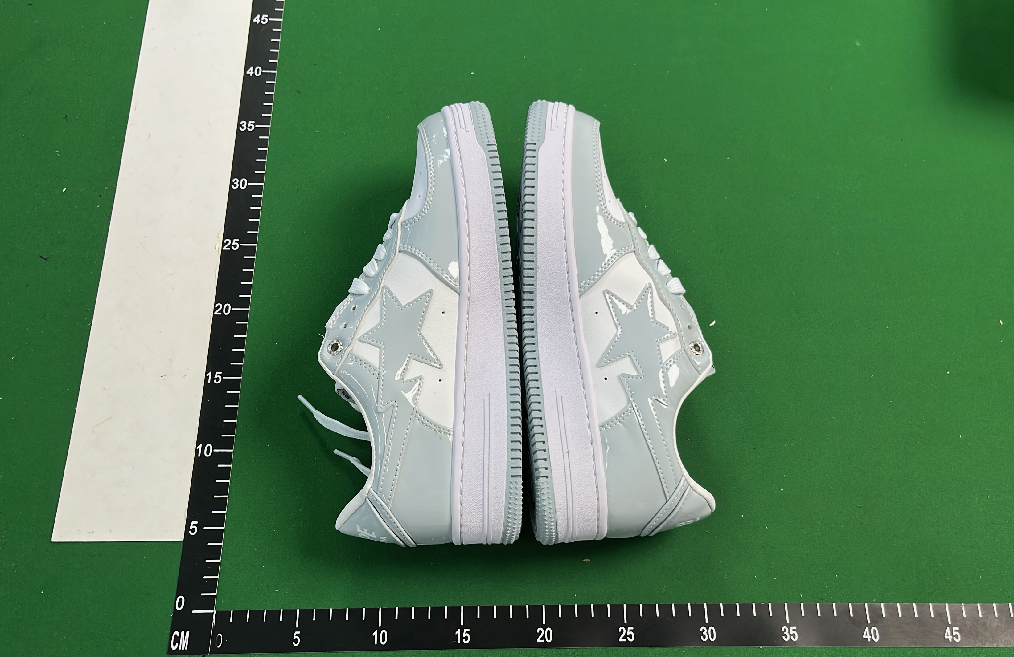 K-Swiss White Low-Top Sneakers with Black Logo Design