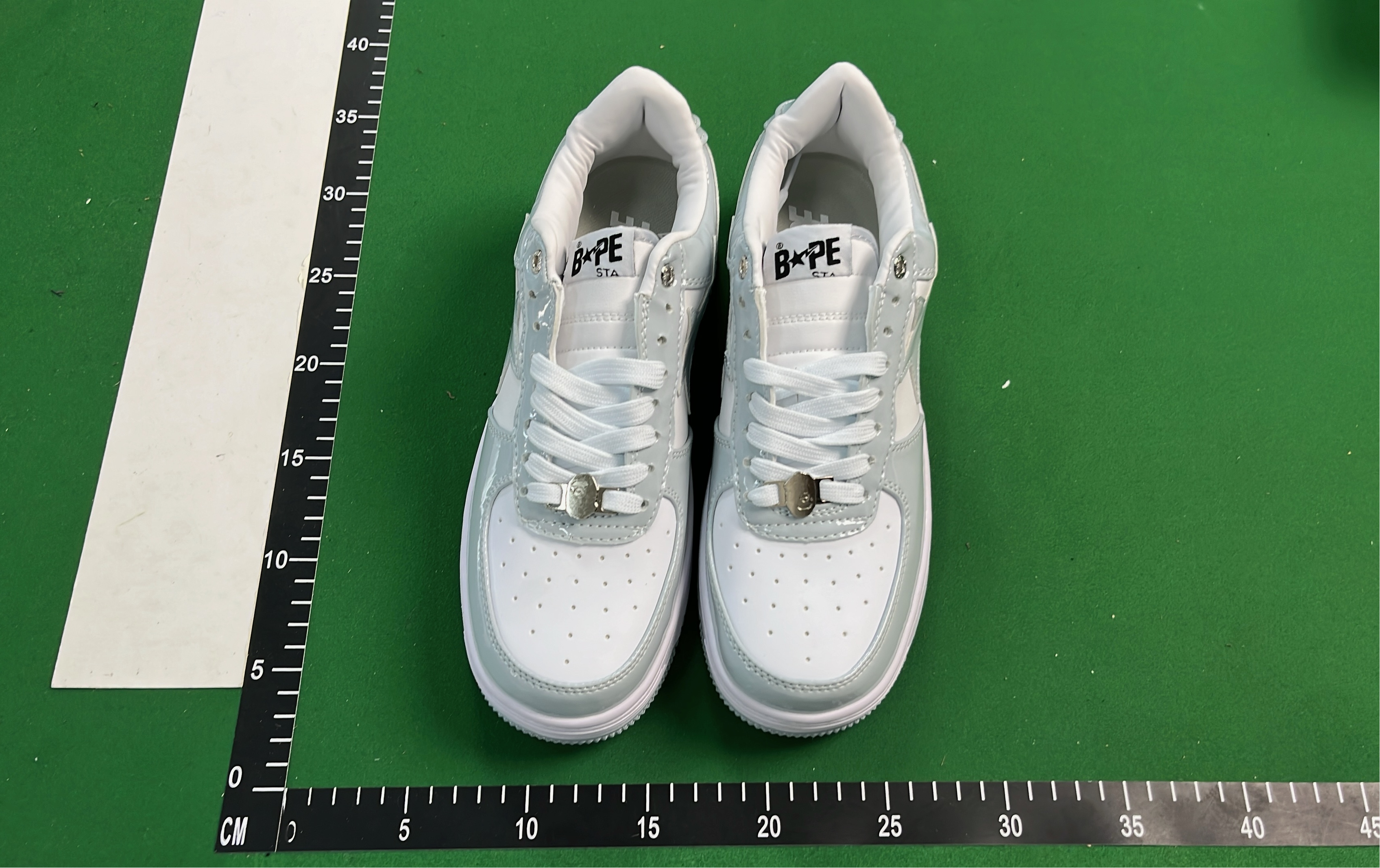 K-Swiss White Low-Top Sneakers with Black Logo Design