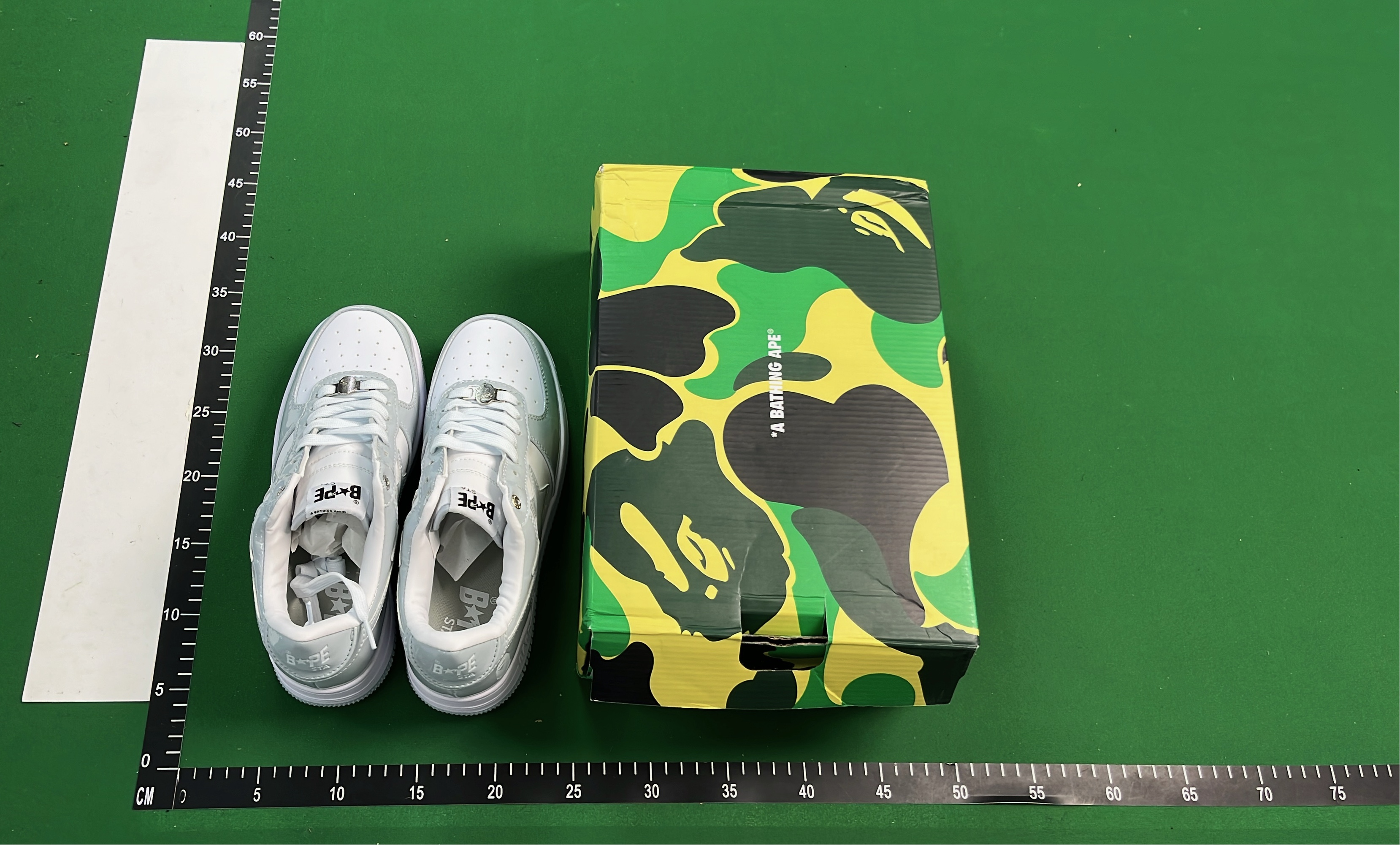 K-Swiss White Low-Top Sneakers with Black Logo Design