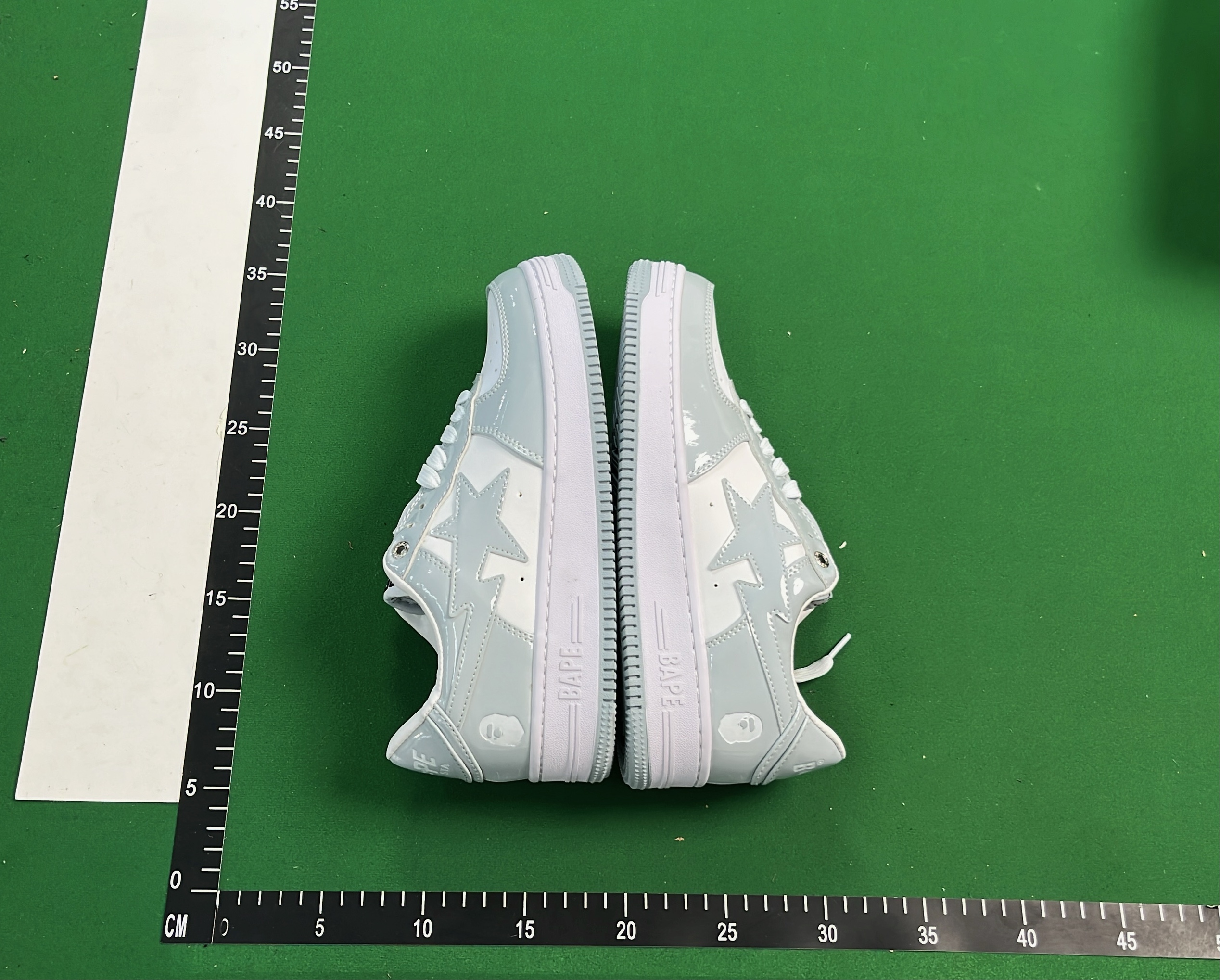 K-Swiss White Low-Top Sneakers with Black Logo Design