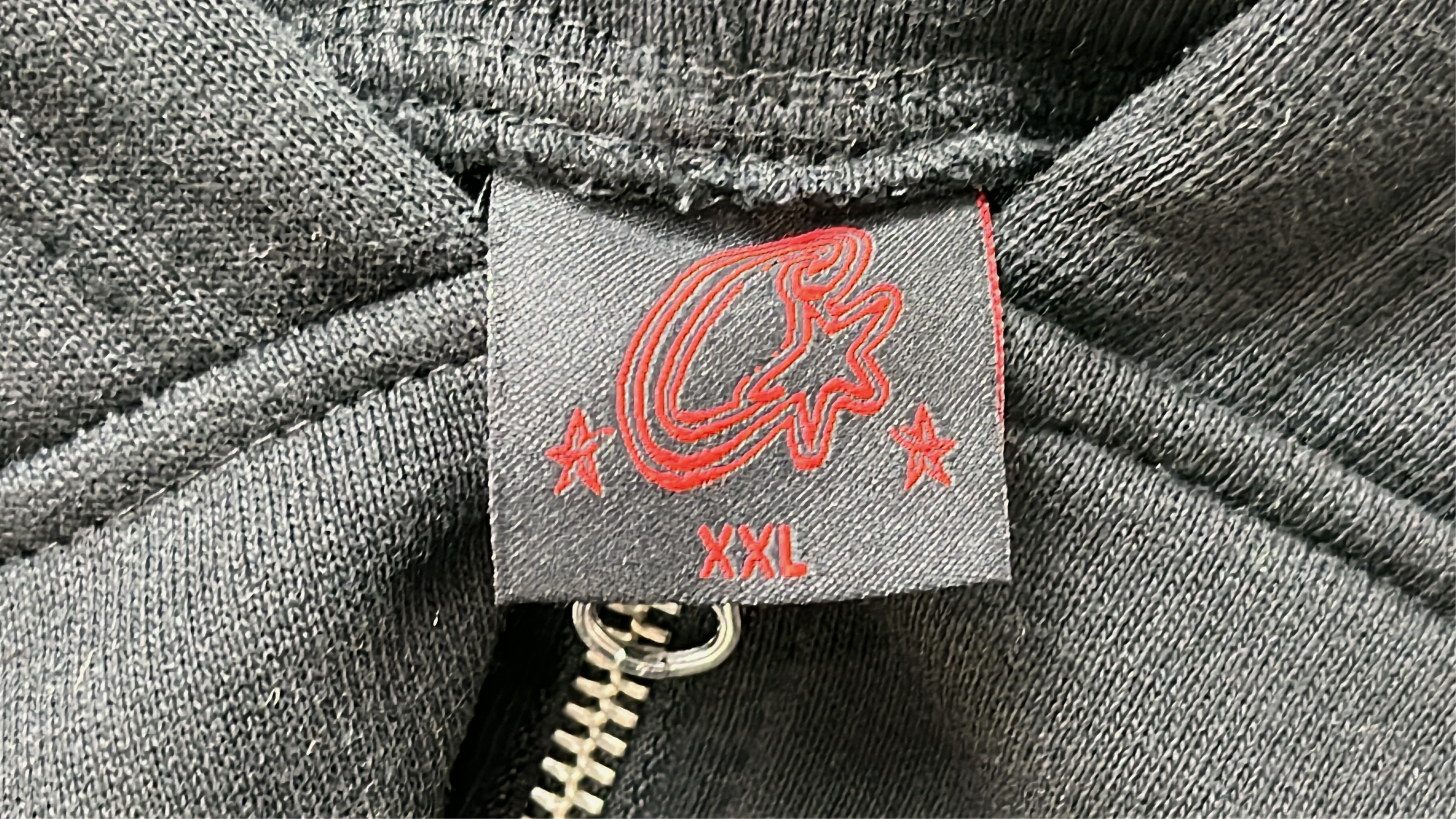Black Zip-Up Hoodie with Red Abstract Print