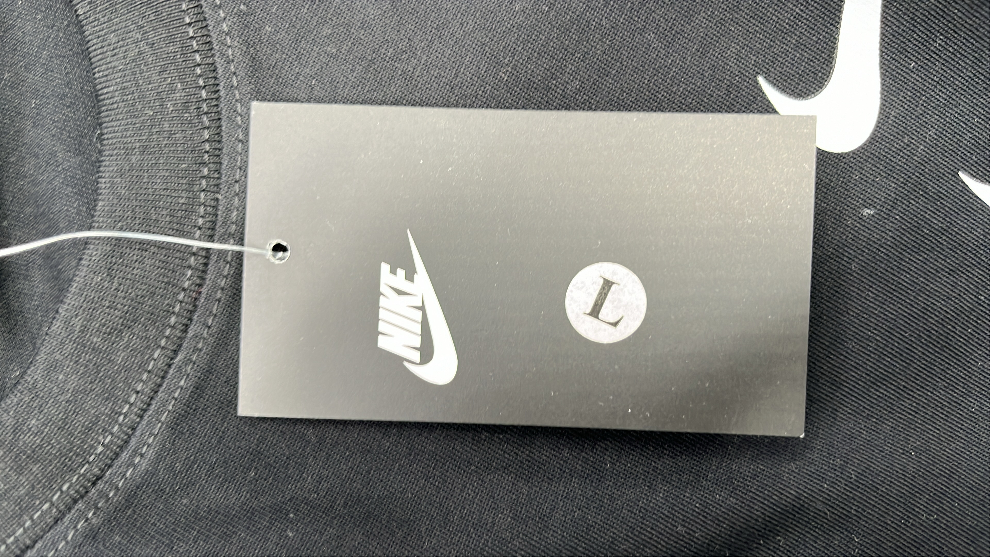Nike White T-Shirt with Black Swoosh Logo