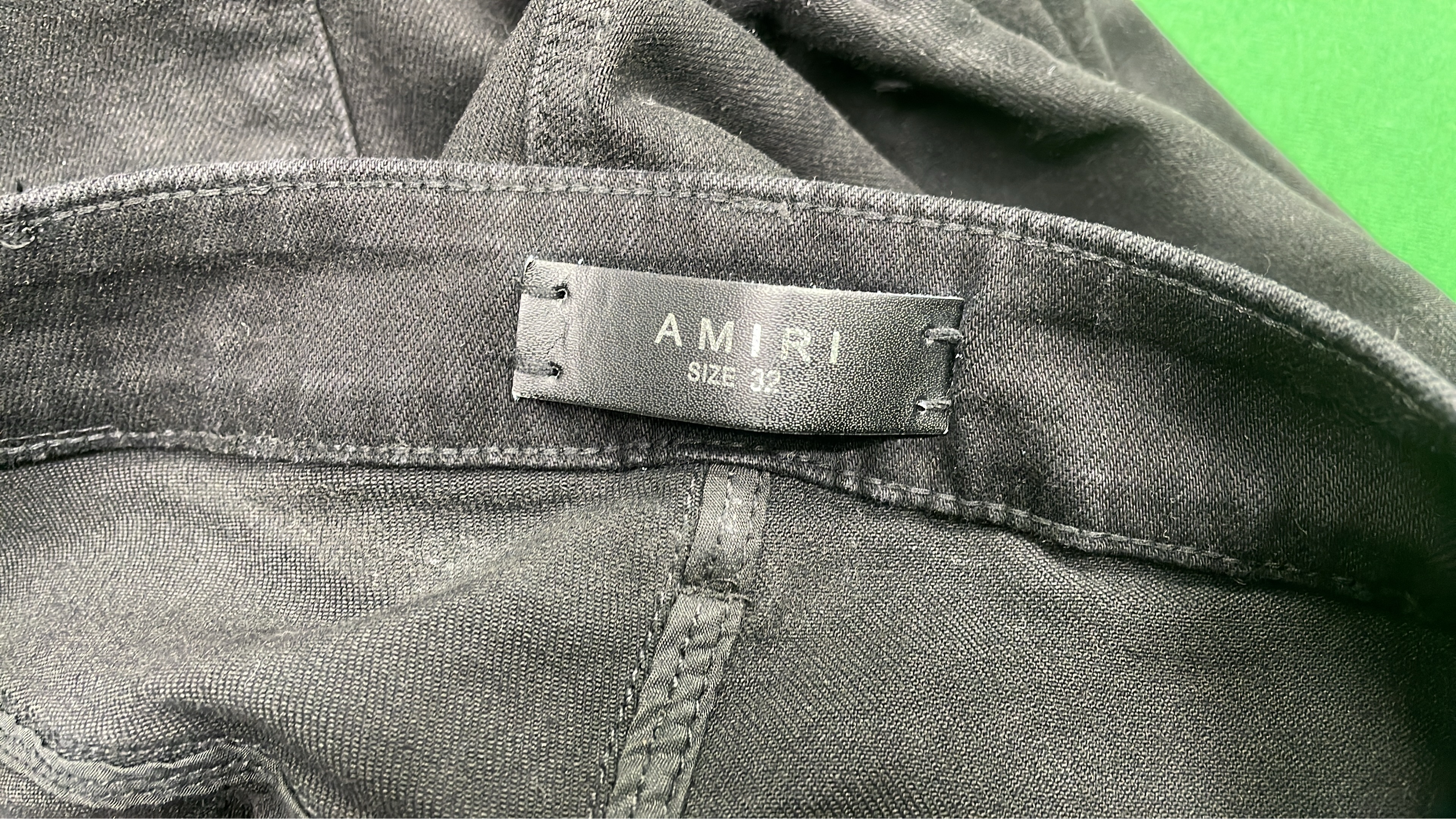 Distressed Black Denim Jeans with Bold Logo Design