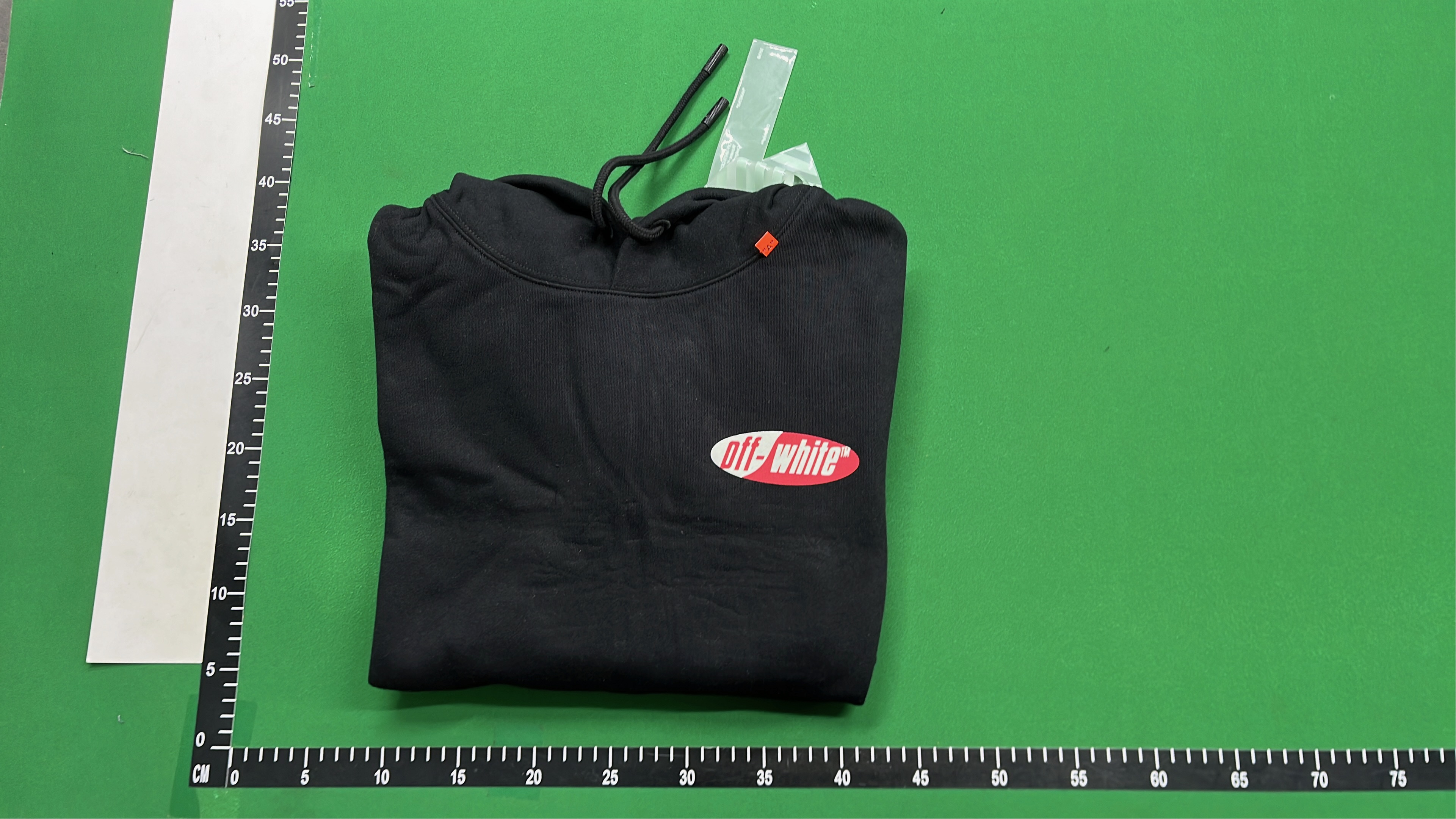 Black Hoodie with Red and White Logo Design