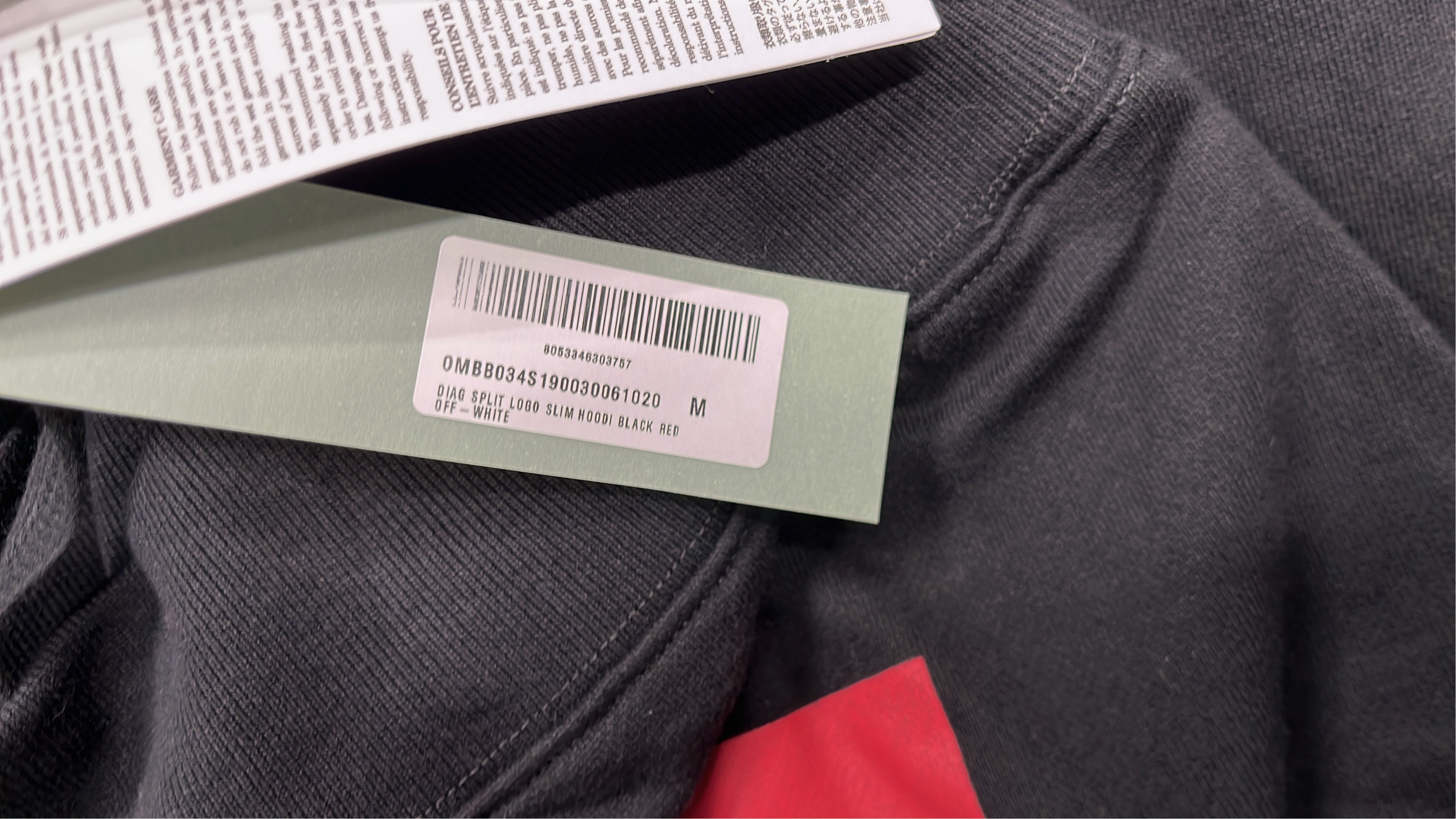 Black Hoodie with Red and White Logo Design