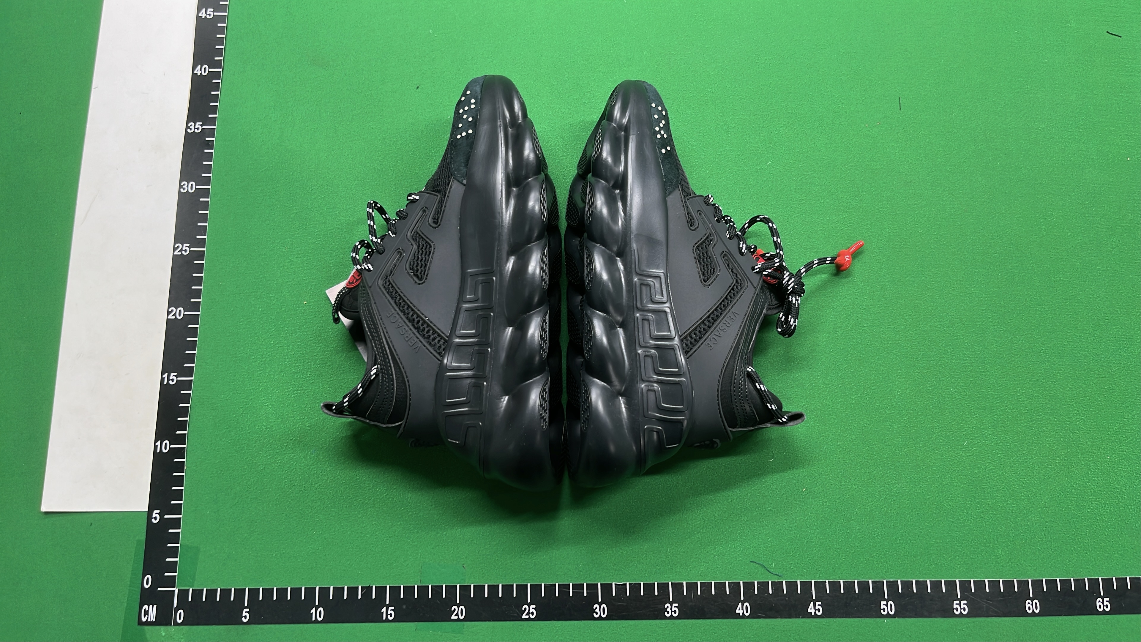 Black Chain Reaction Sneakers with Mesh Design and Bold Logo