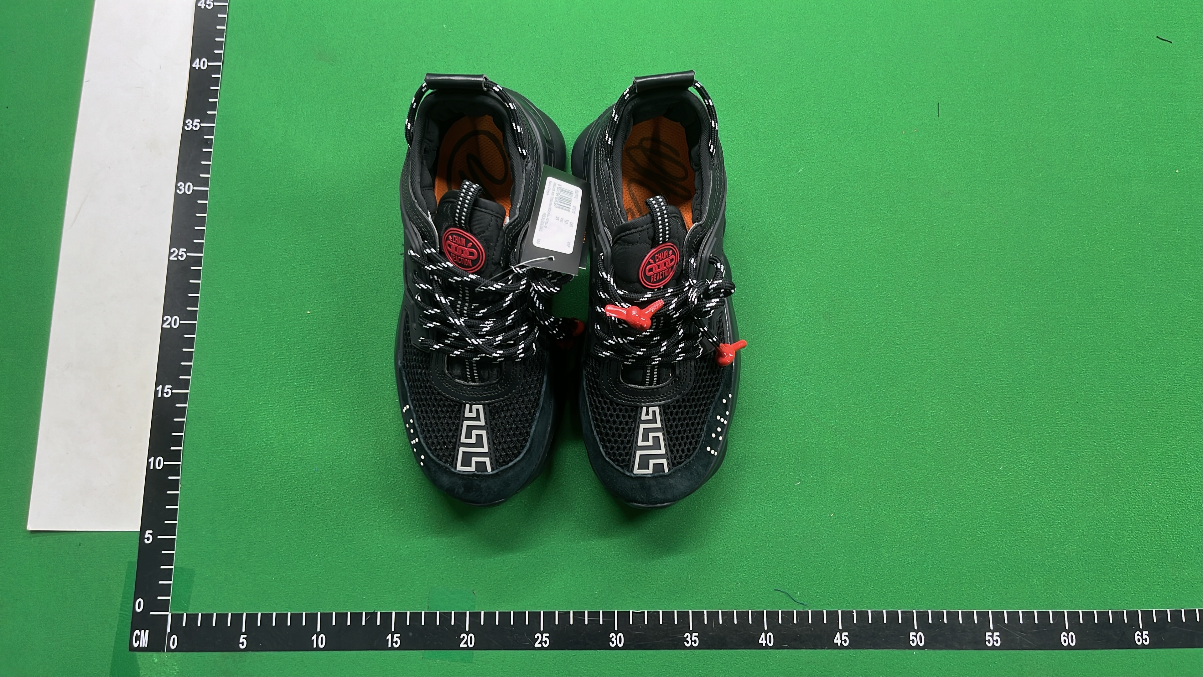 Black Chain Reaction Sneakers with Mesh Design and Bold Logo