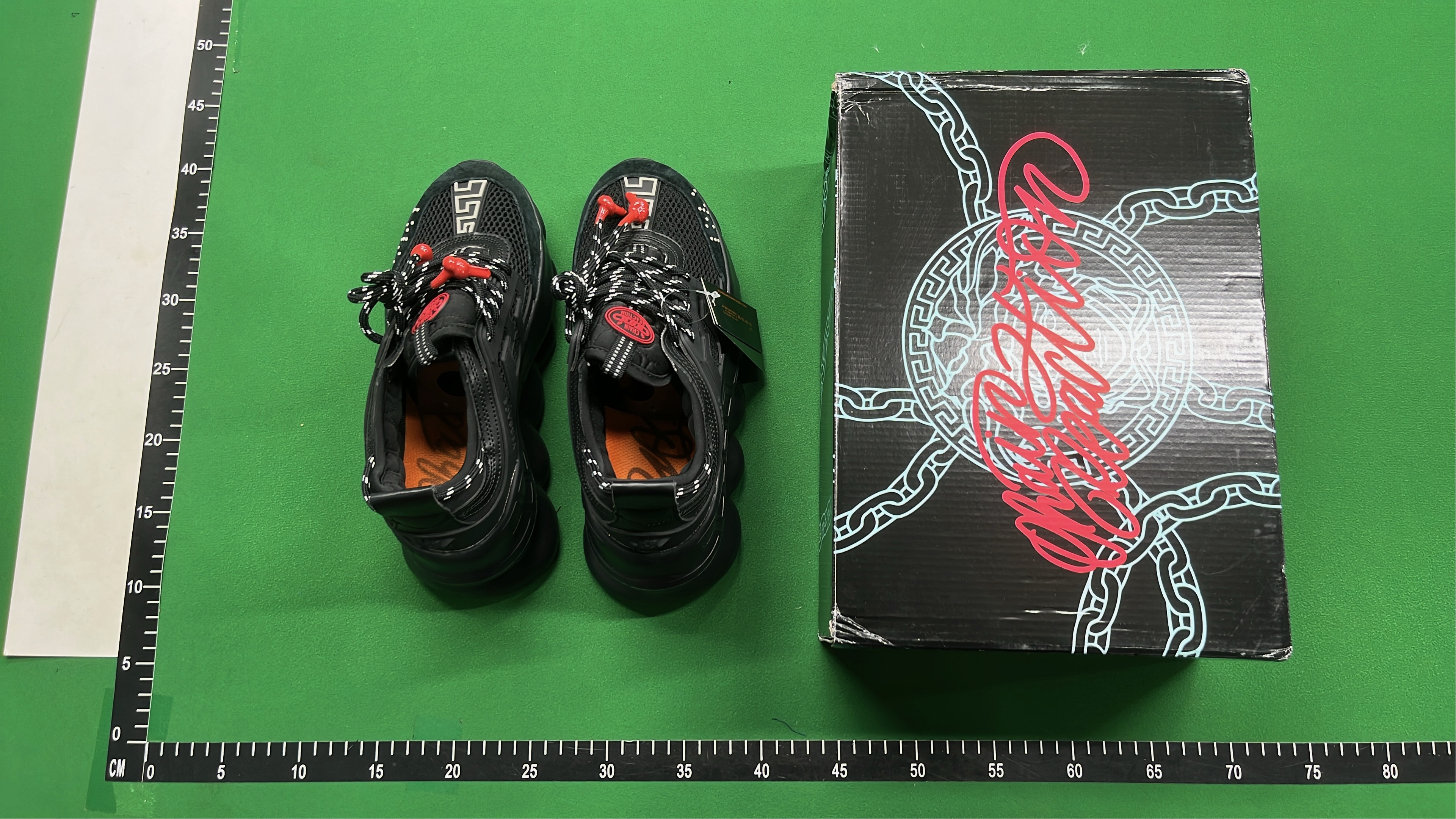 Black Chain Reaction Sneakers with Mesh Design and Bold Logo