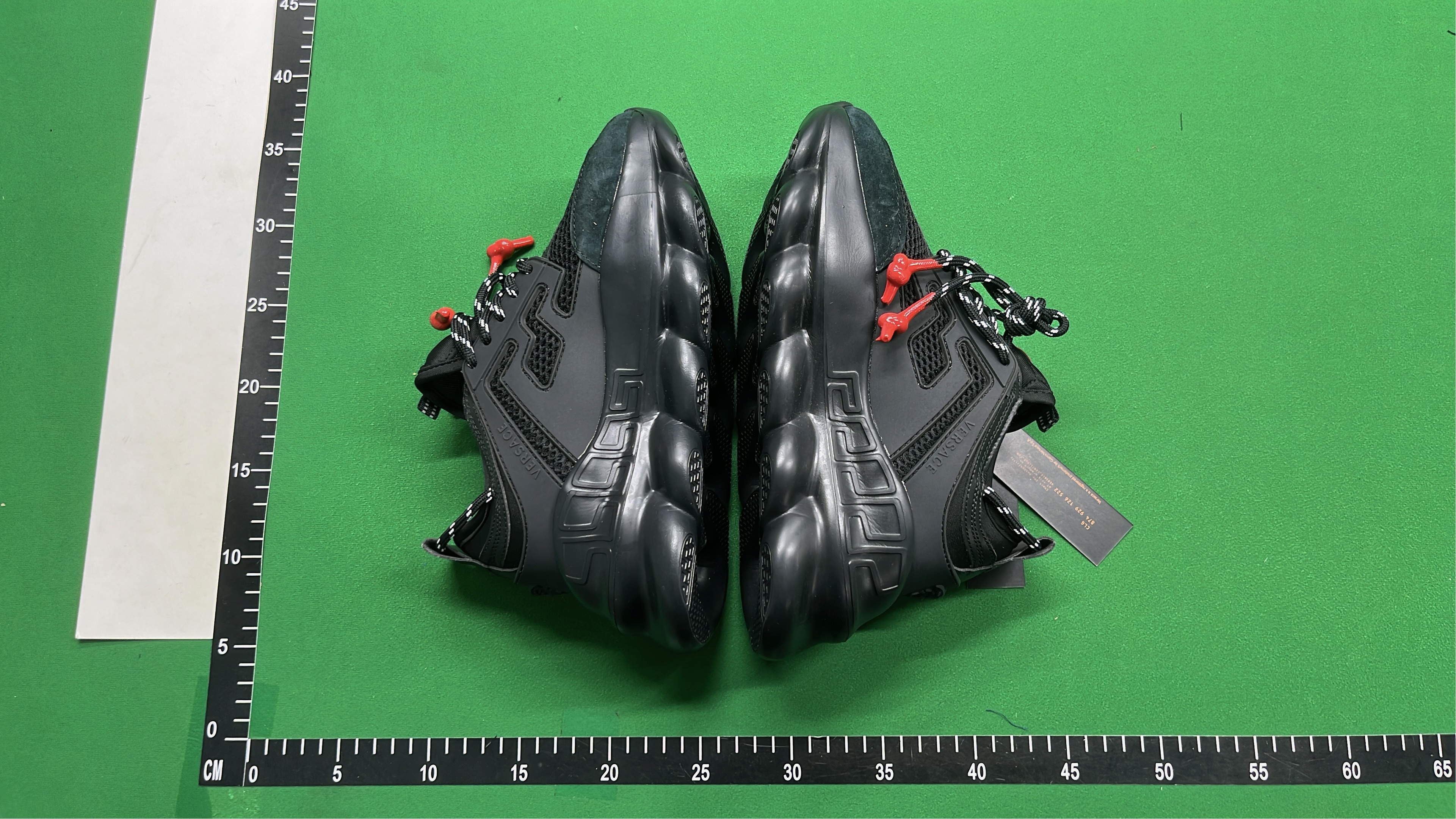 Black Chain Reaction Sneakers with Mesh Design and Bold Logo