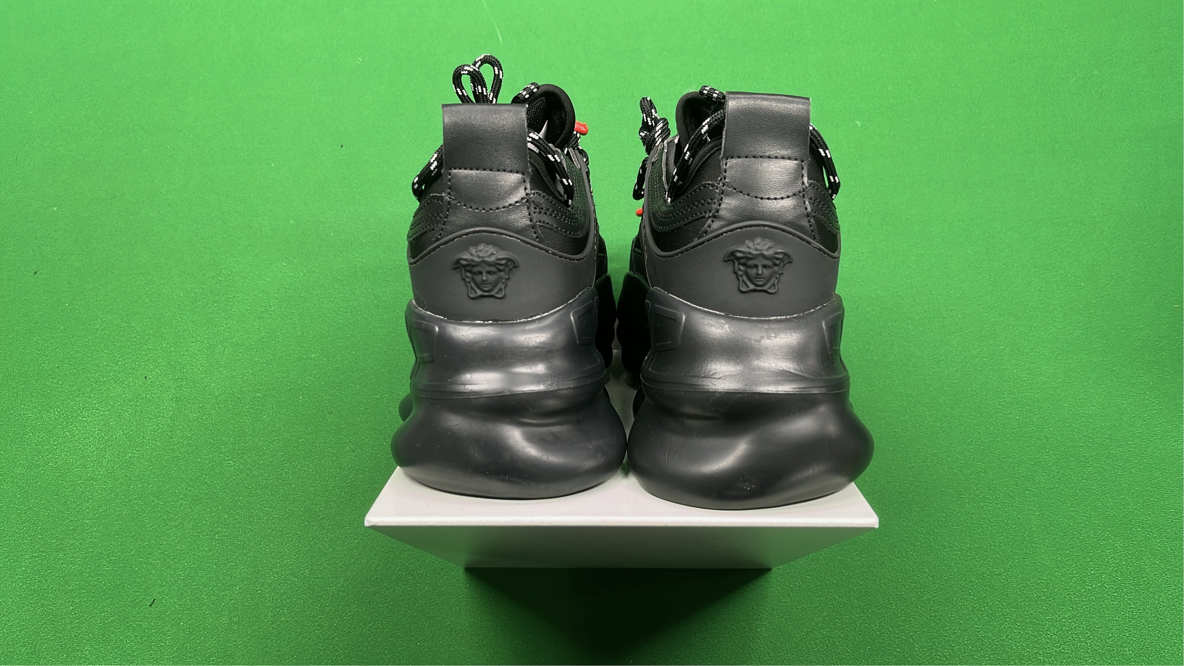 Black Chain Reaction Sneakers with Mesh Design and Bold Logo