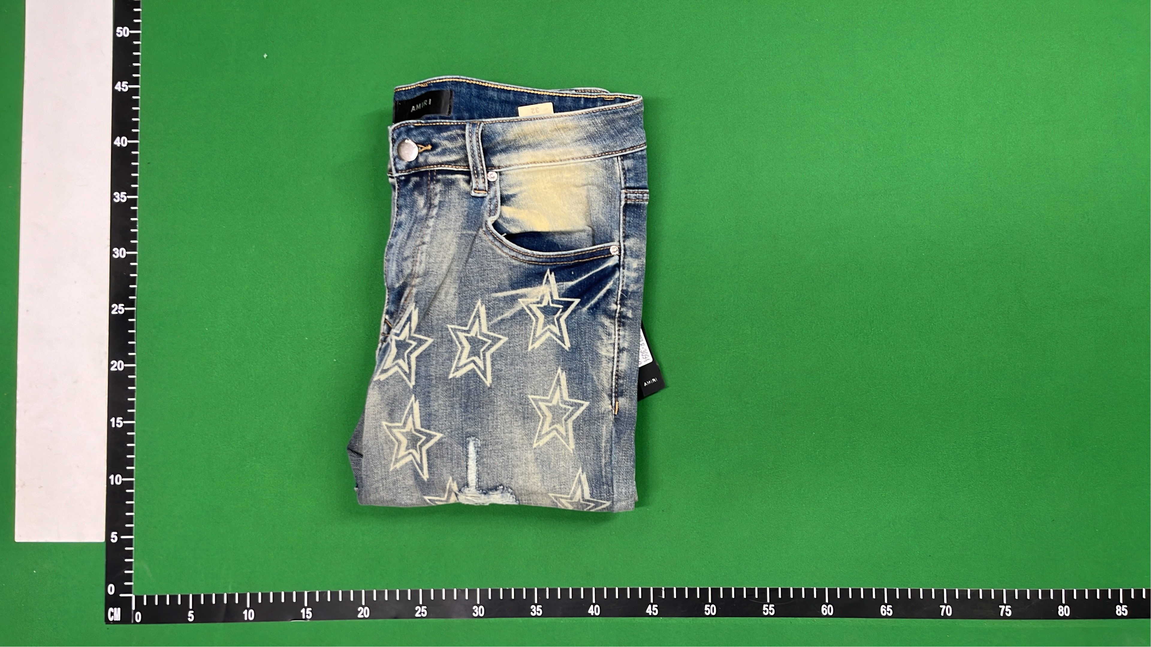 AMIRI Star Print Distressed Denim Jeans