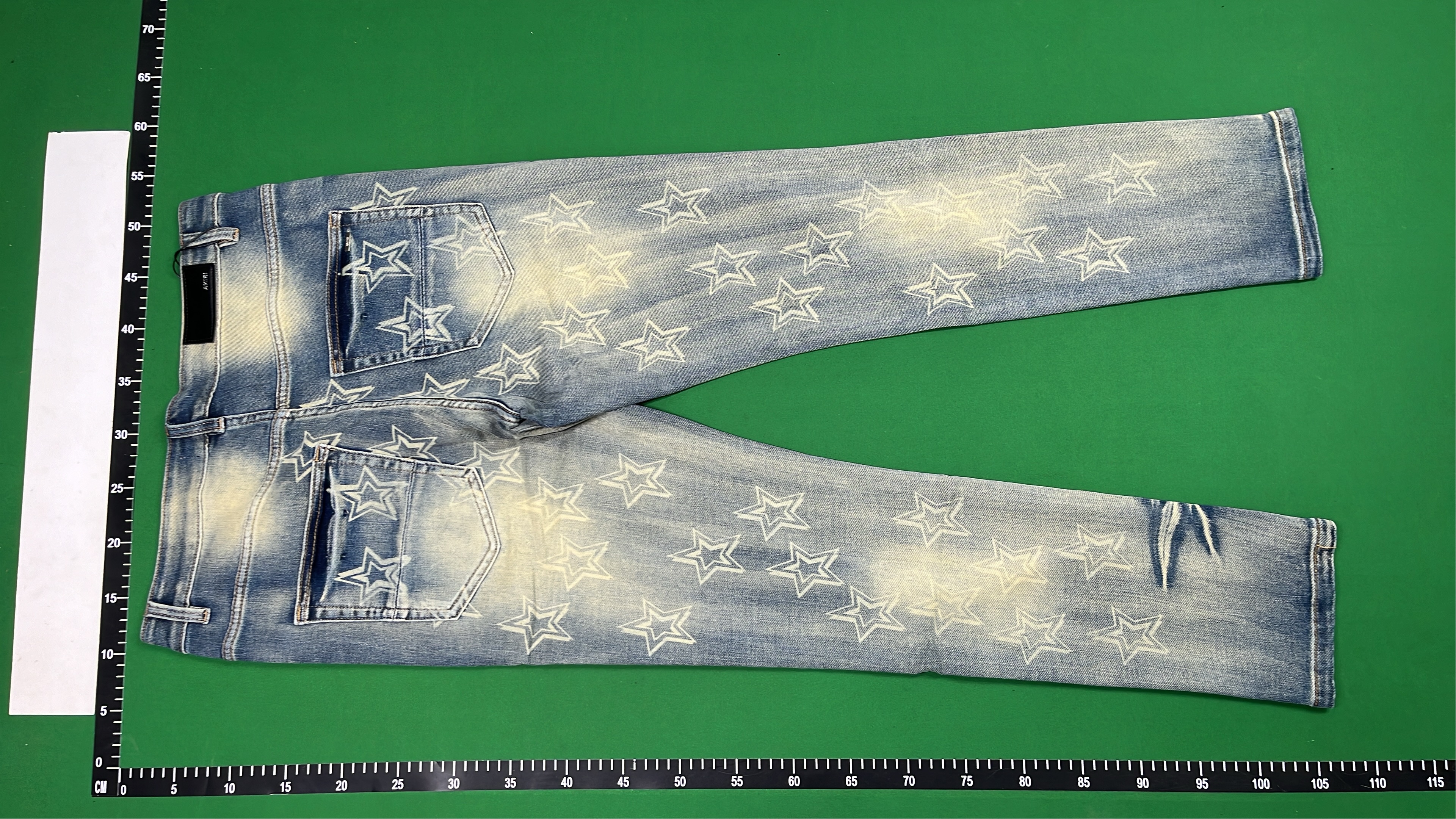 AMIRI Star Print Distressed Denim Jeans
