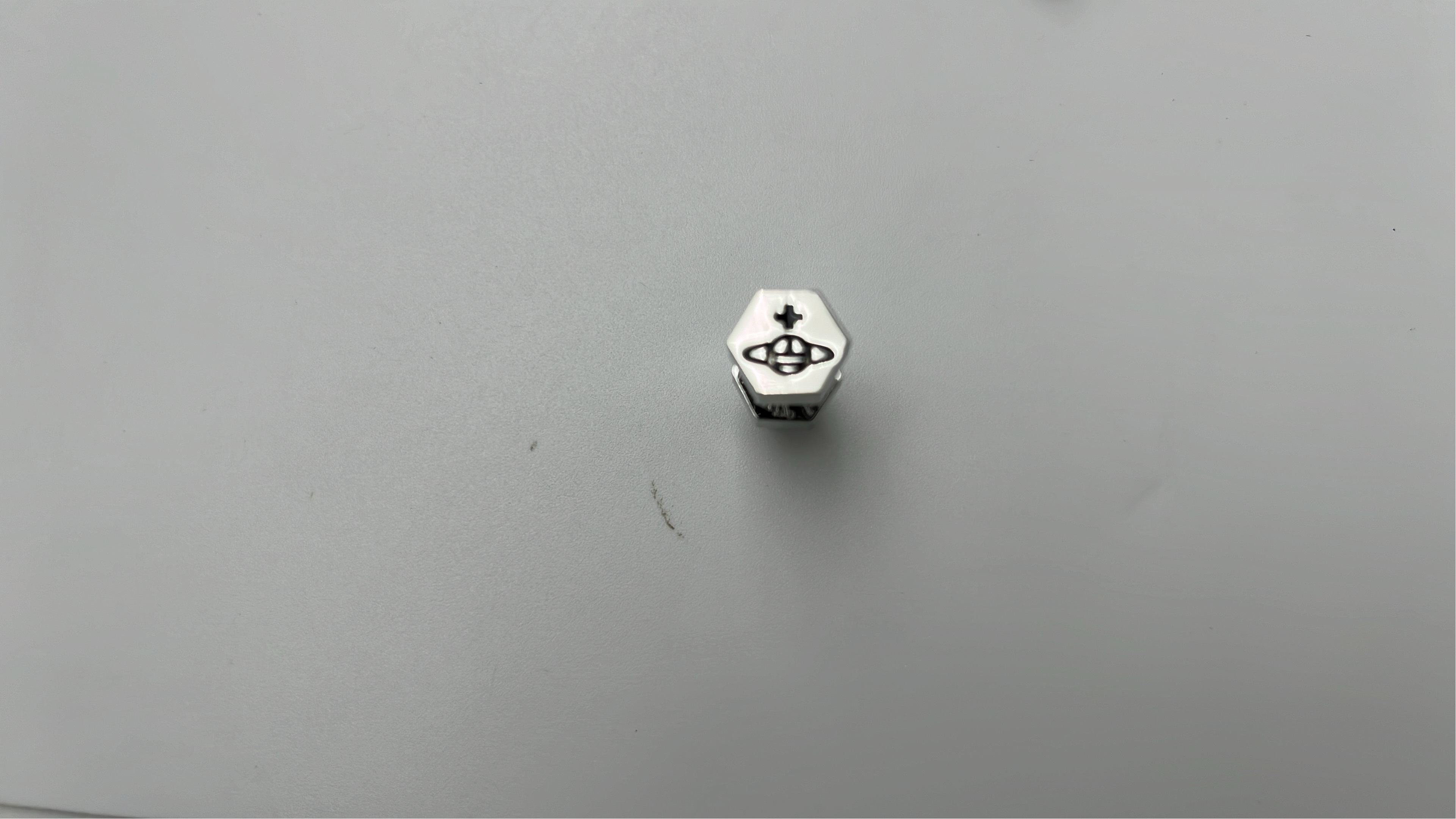 Gold Hexagon Stud Earrings with Orb Logo