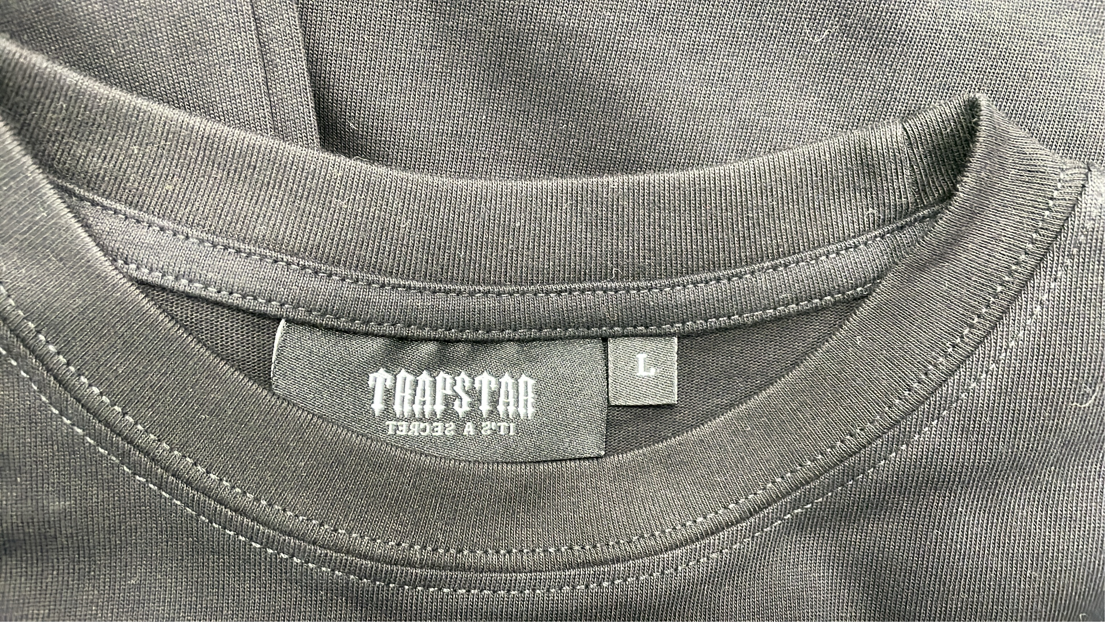 Trap Star Black T-Shirt with Purple Graphic Design