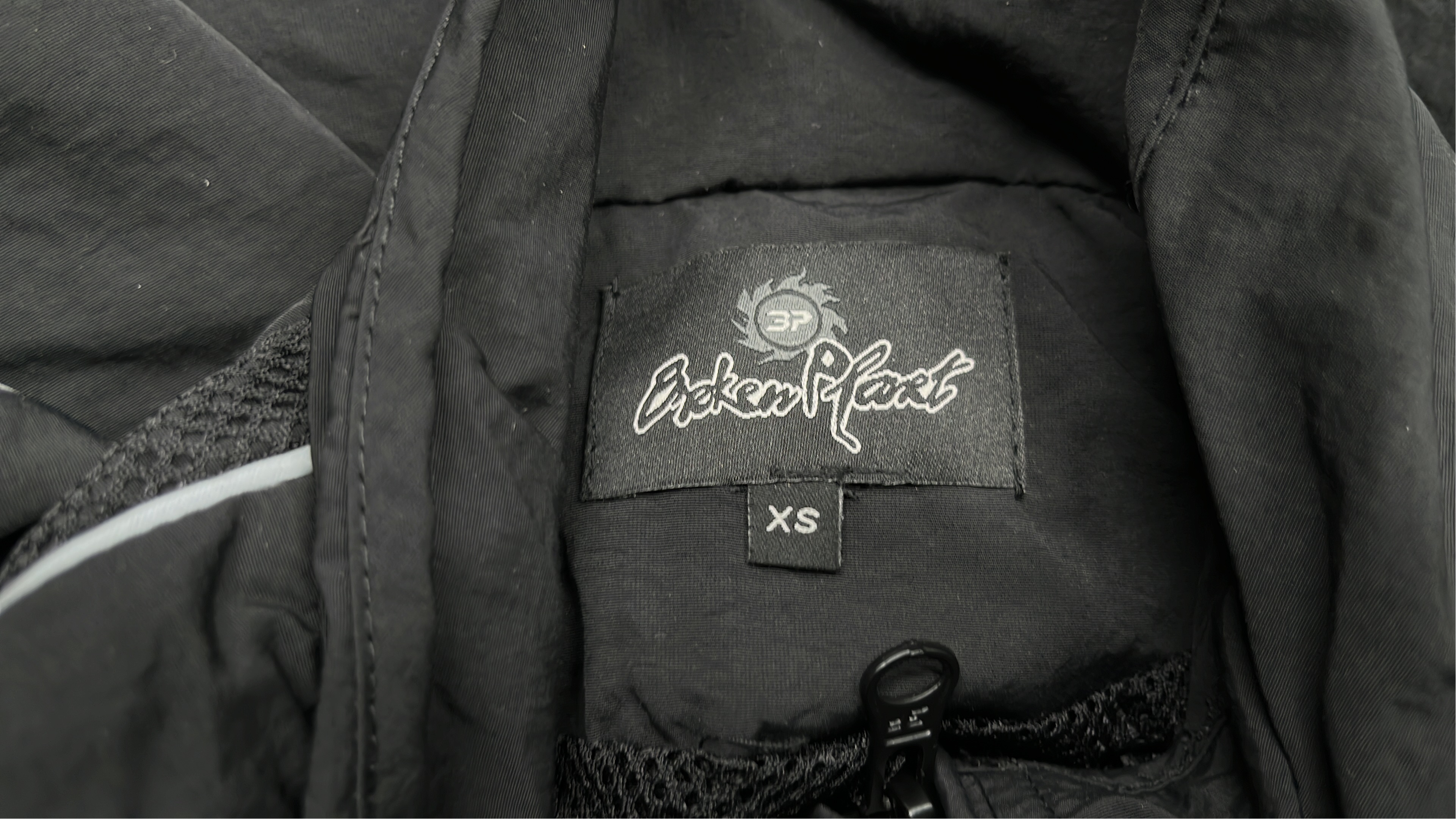 Black Track Jacket with White Stitching and Logo