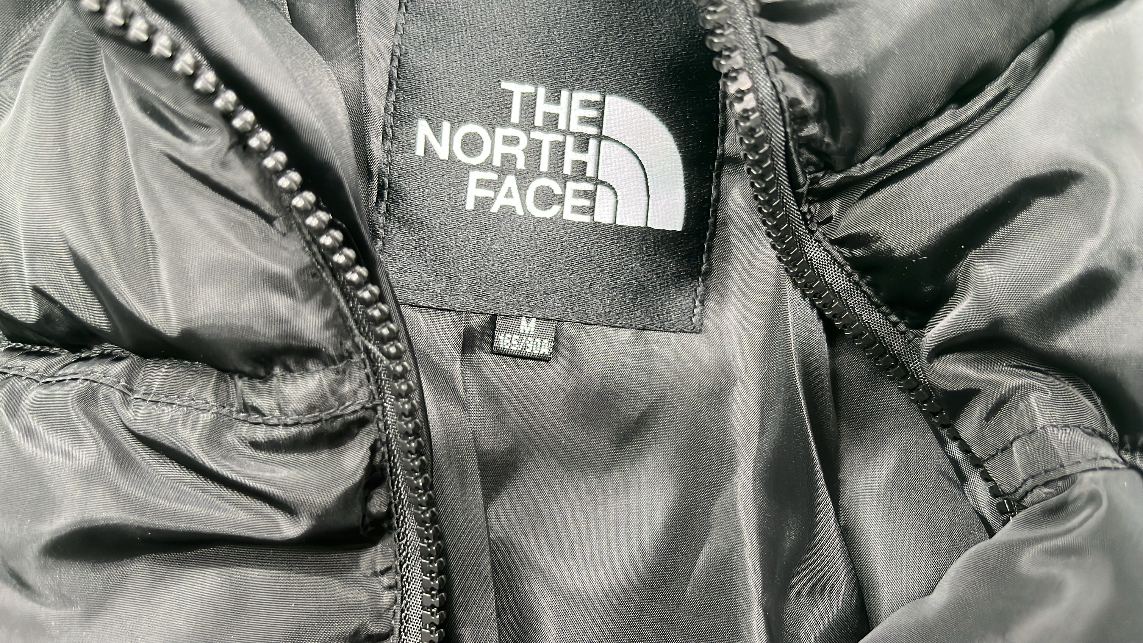 The North Face White Puffer Jacket with Black Hood