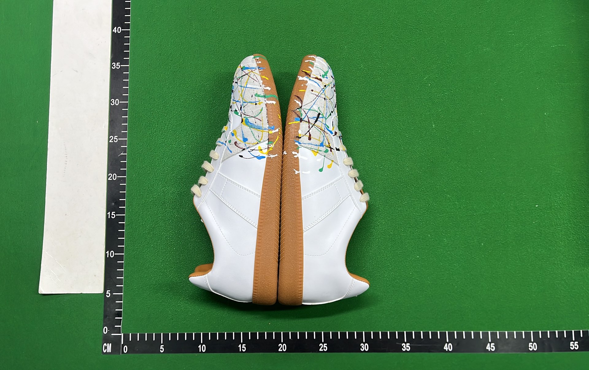 Adidas White Sneakers with Colorful Paint Splatter Design