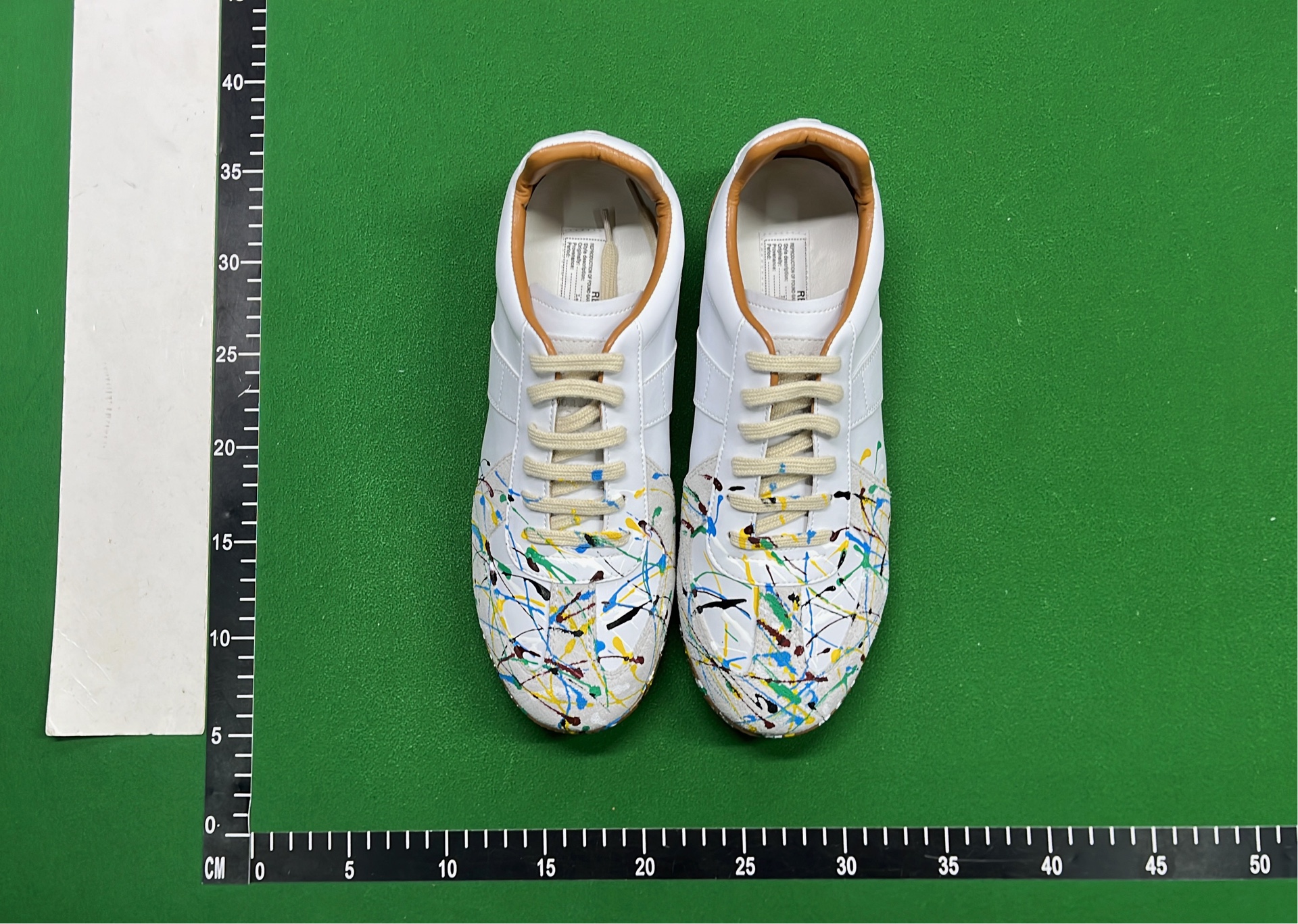 Adidas White Sneakers with Colorful Paint Splatter Design